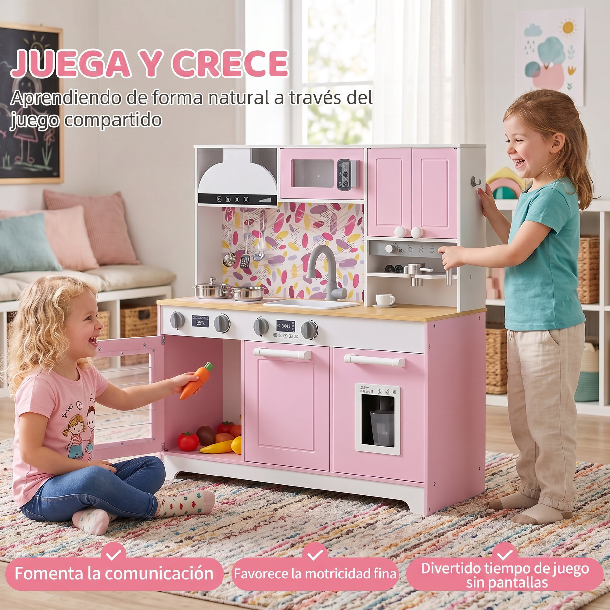 Dos niñas juegan con una gran cocina de juguete rosa y blanca en una alfombra colorida.
