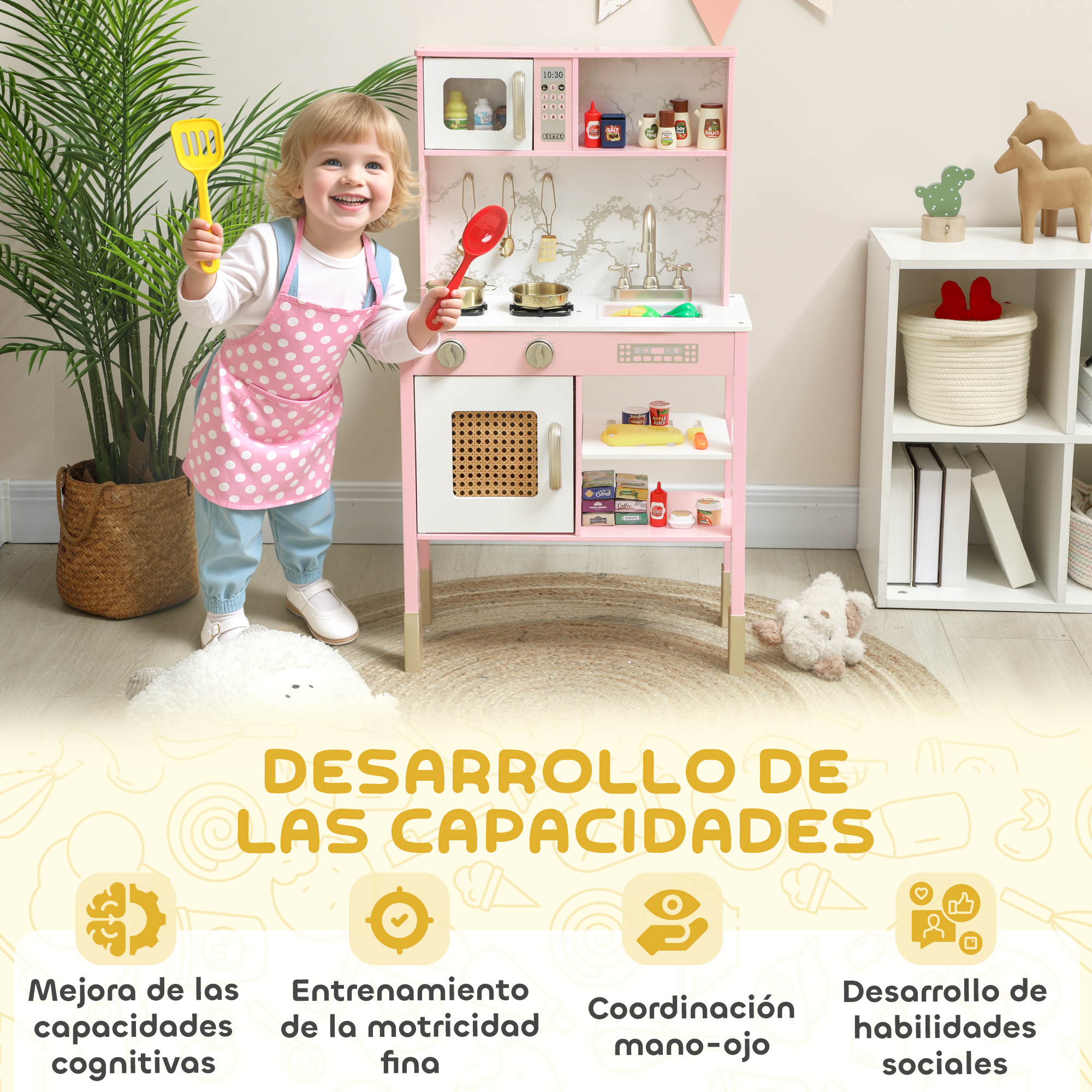 Un niño pequeño sonriente con un delantal rosa juega con una cocina de juguete.
