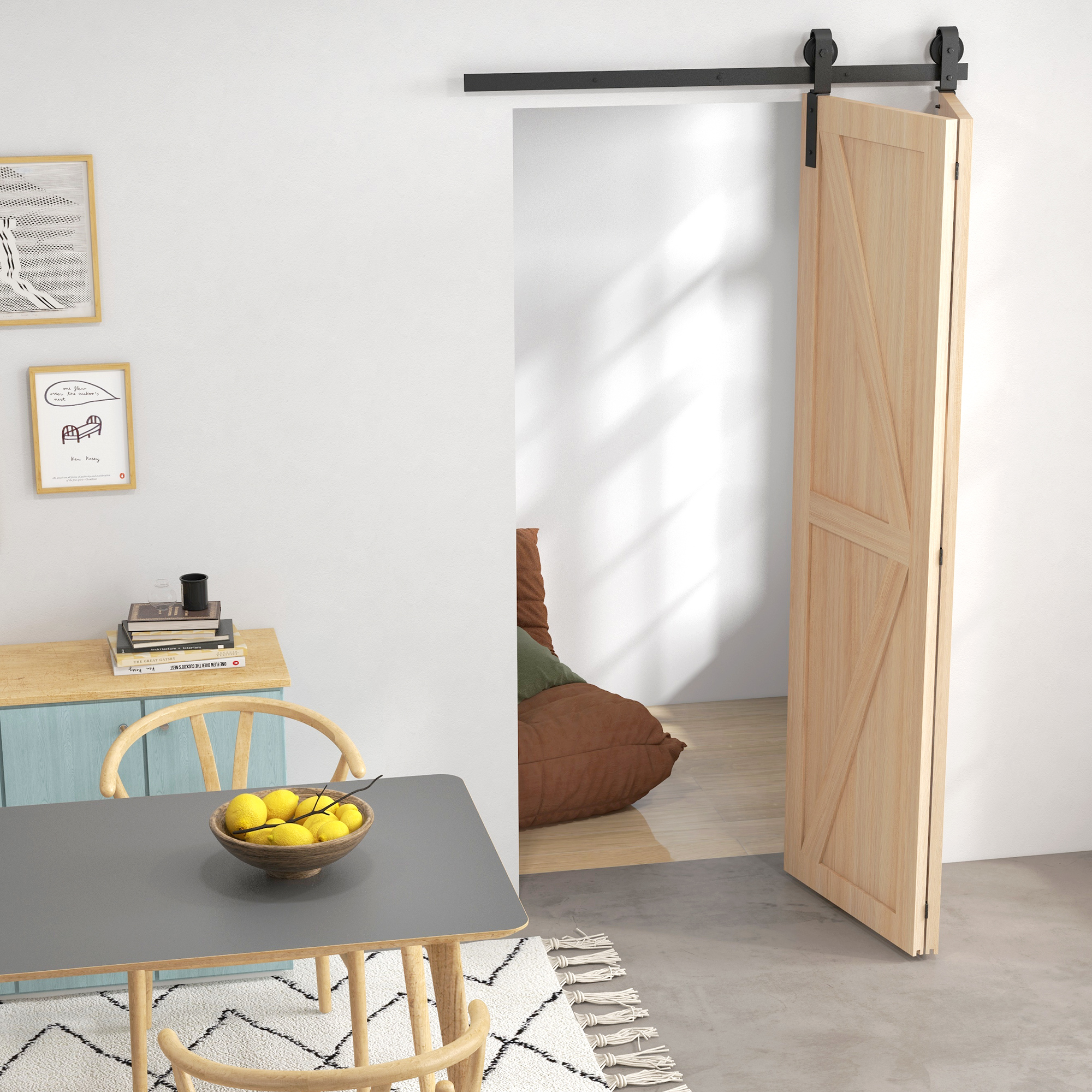 Una habitación luminosa con puerta corredera de madera, mesa de comedor con frutas amarillas y cuadros.