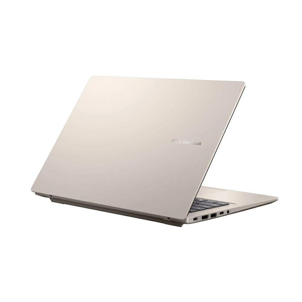 Un computer portatile ASUS Vivobook dorato chiuso su sfondo bianco, visto di lato.