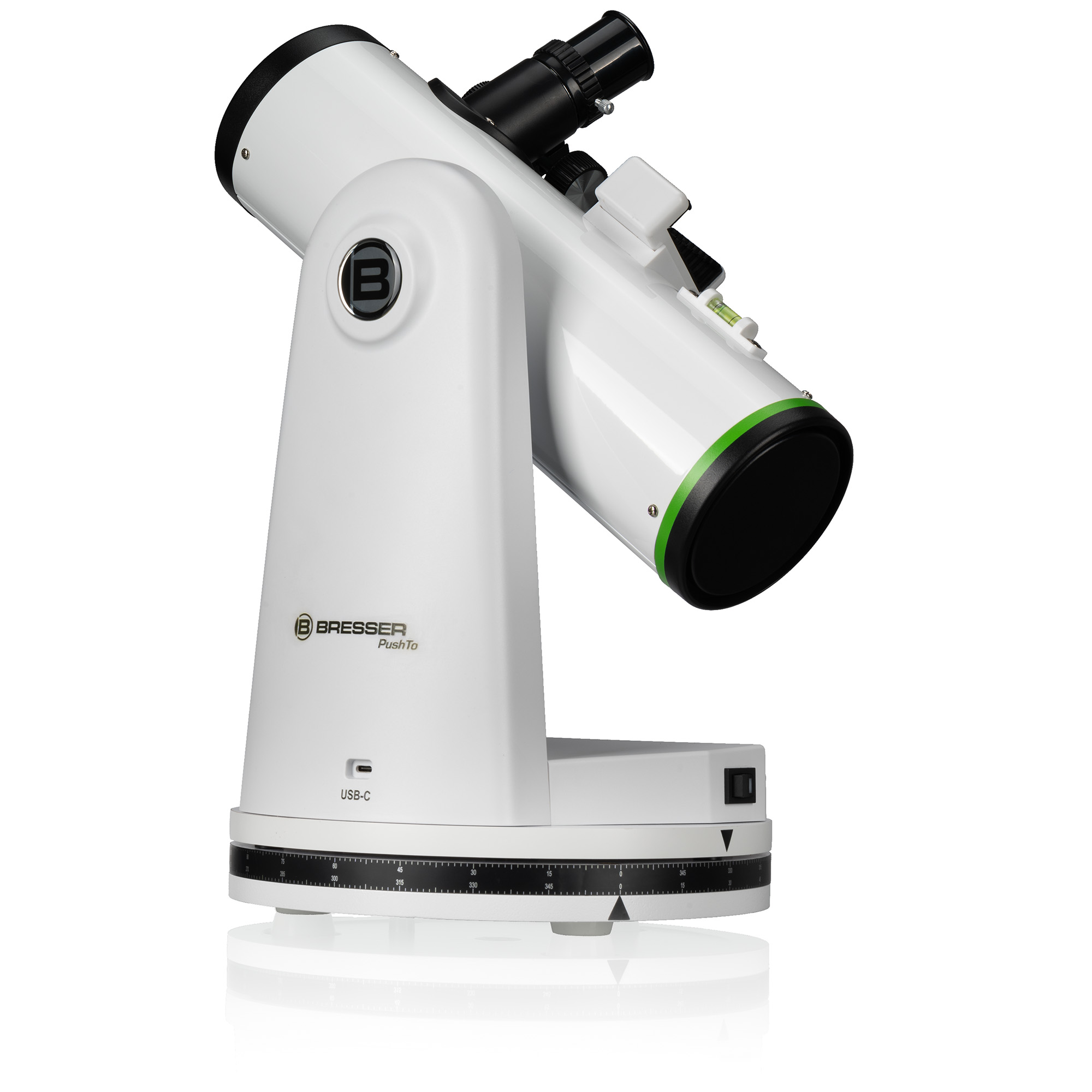Un telescopio de mesa Bresser PushTo blanco con un anillo verde y ocular negro, aislado sobre un fondo blanco.