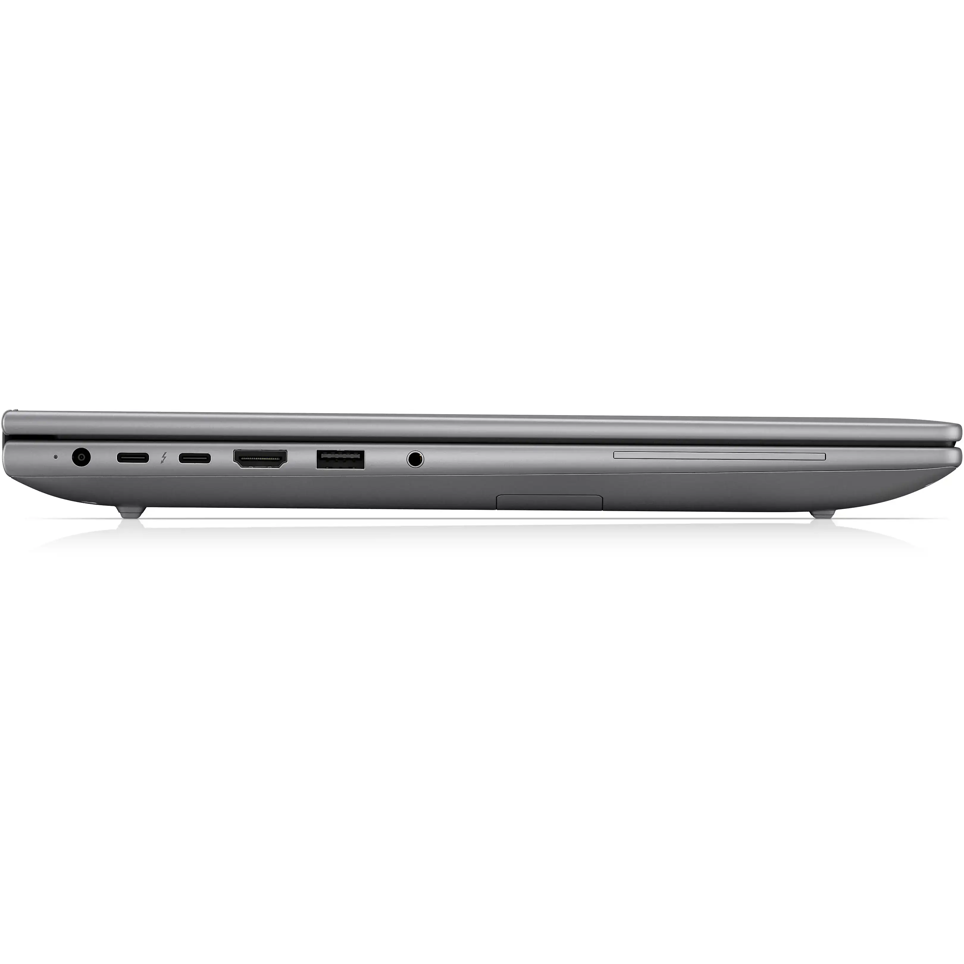 Vista laterale di un laptop grigio chiuso con varie porte su sfondo nero.