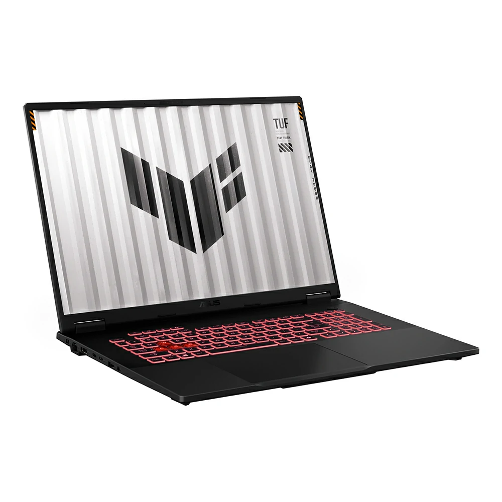 Un computer portatile da gioco Asus TUF nero con retroilluminazione della tastiera rossa e il logo TUF sullo schermo.