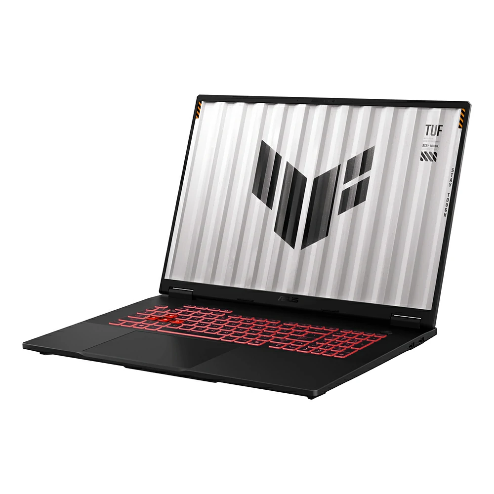 Un computer portatile da gioco Asus TUF nero con retroilluminazione della tastiera rossa e sfondo geometrico.