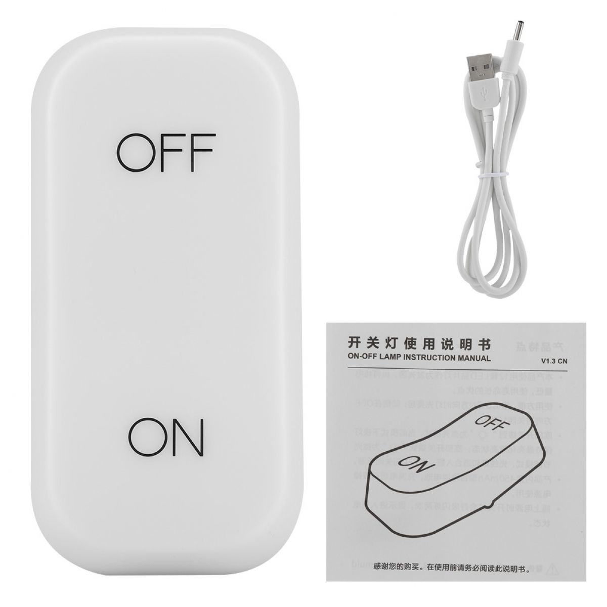 Ein weißer, länglicher Ein-Aus-Schalter, ein USB-Kabel und ein Handbuch vor weißem Hintergrund.