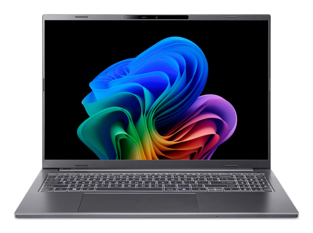 Ein grauer Laptop mit einer farbenfrohen, abstrakten Blütengrafik auf dem Bildschirm und einer beleuchteten Tastatur.