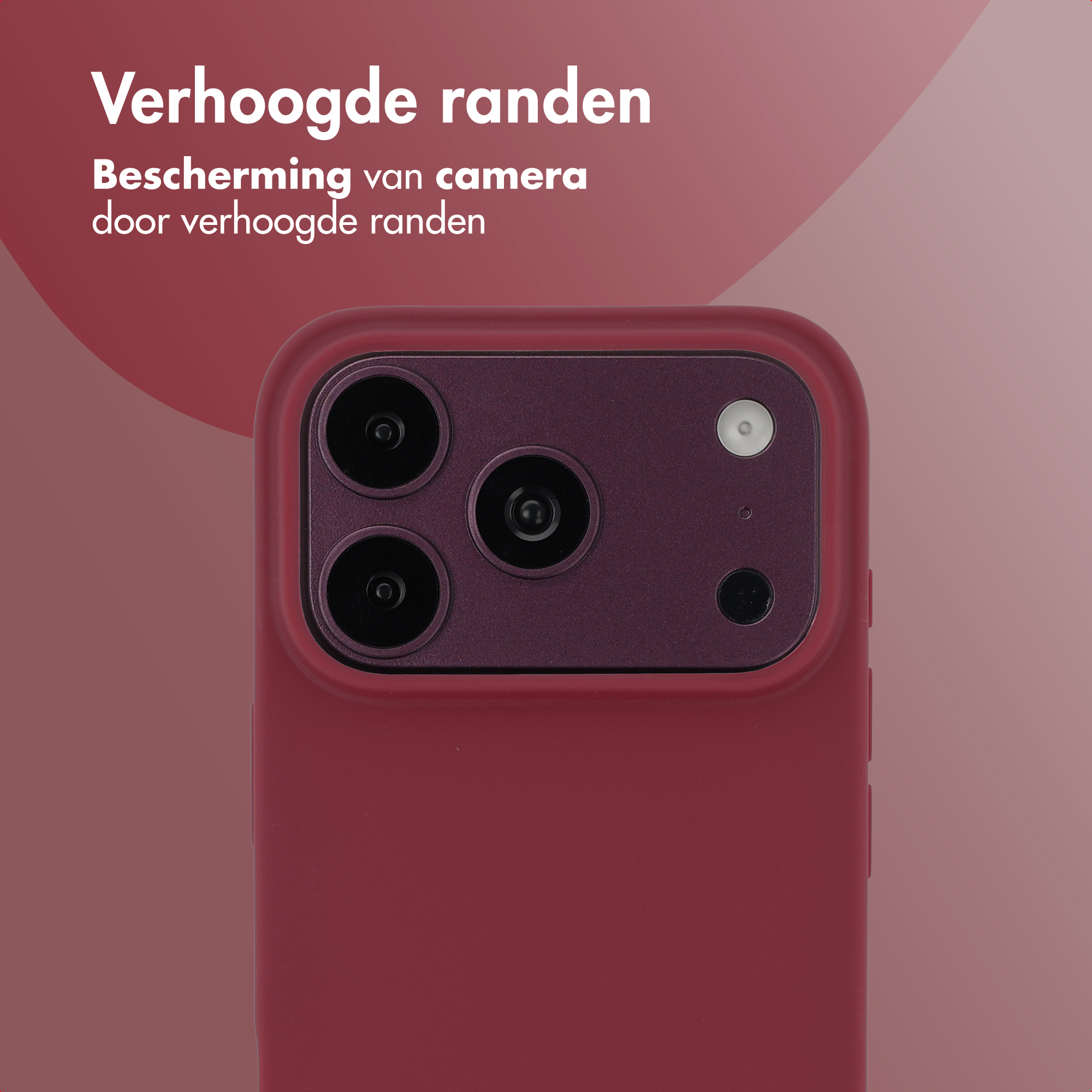 Close-up van een rode smartphonecameramodule met opstaande randen tegen een roZE achtergrond.