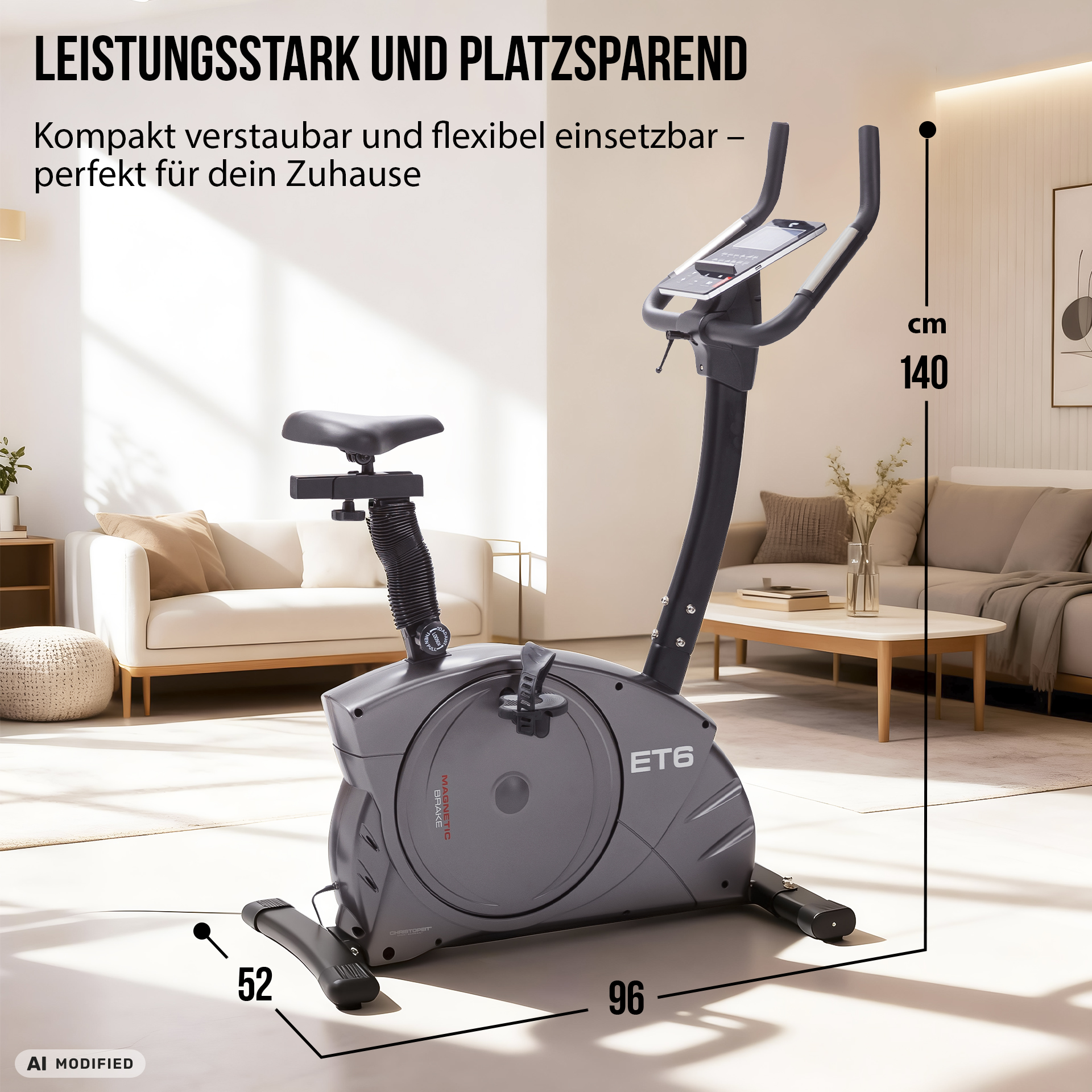 Ein grauer Heimtrainer ET6 steht im Wohnzimmer mit Maßangaben für Höhe, Länge und Breite.