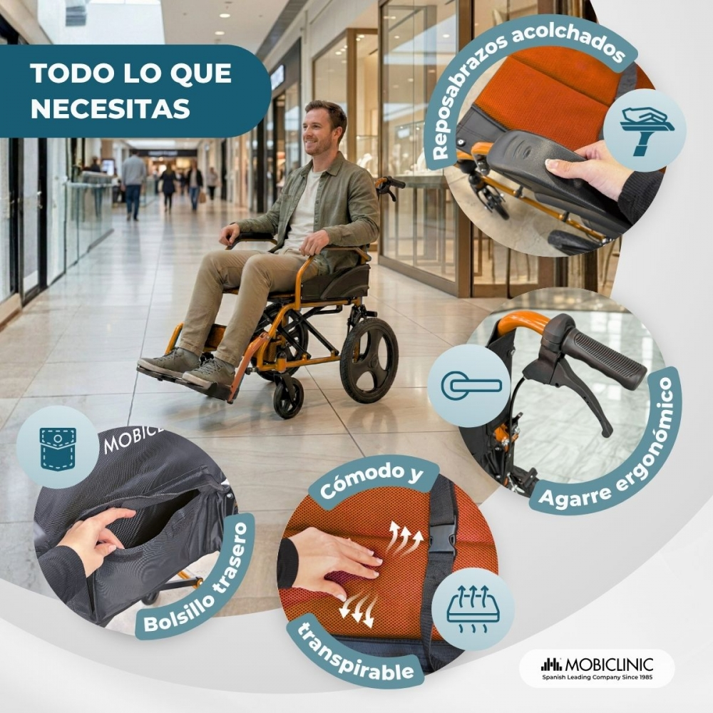 Un hombre sentado en una silla de ruedas naranja y negra en un centro comercial, con detalles.
