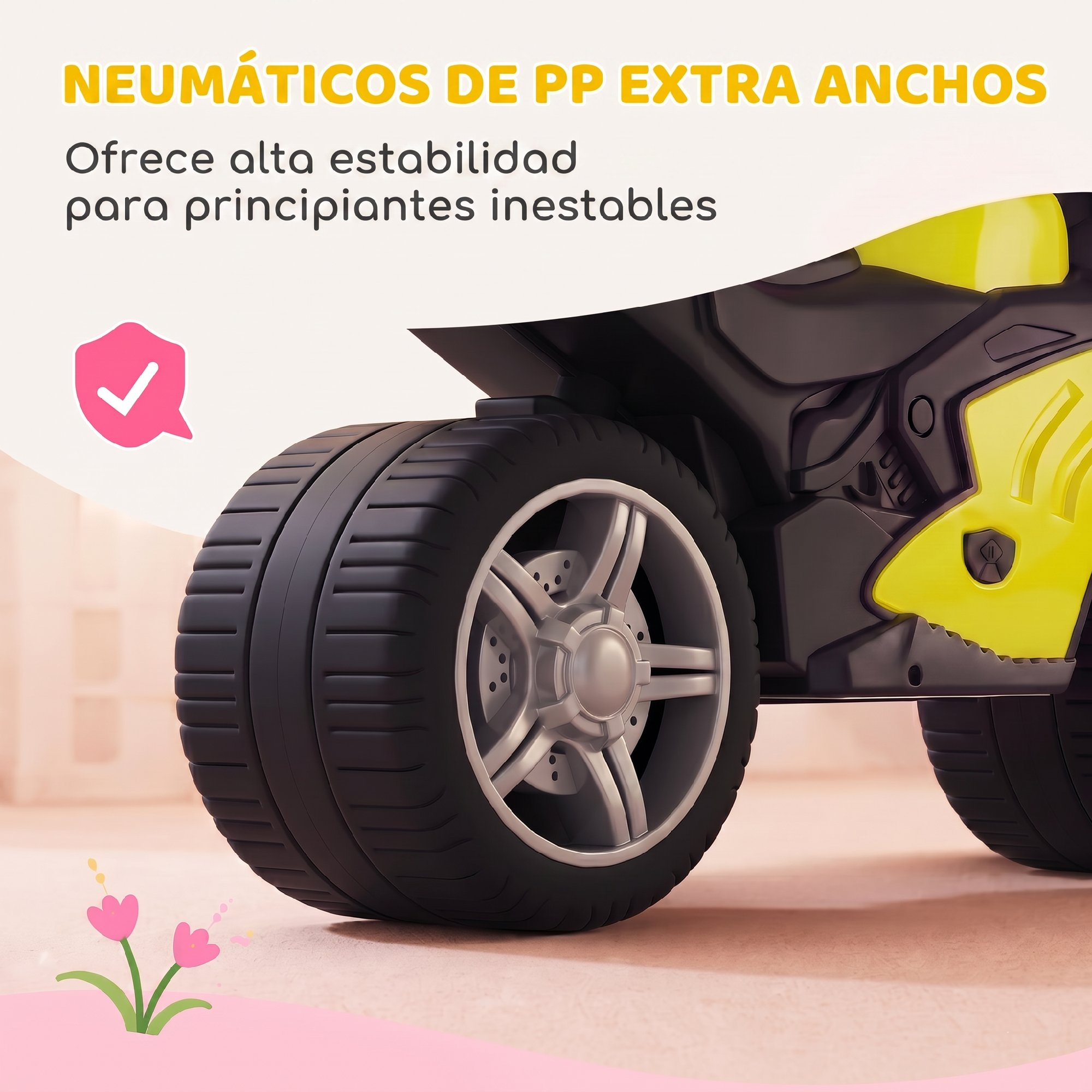 Neumático de PP negro ancho en un vehículo infantil amarillo y negro para mayor estabilidad.