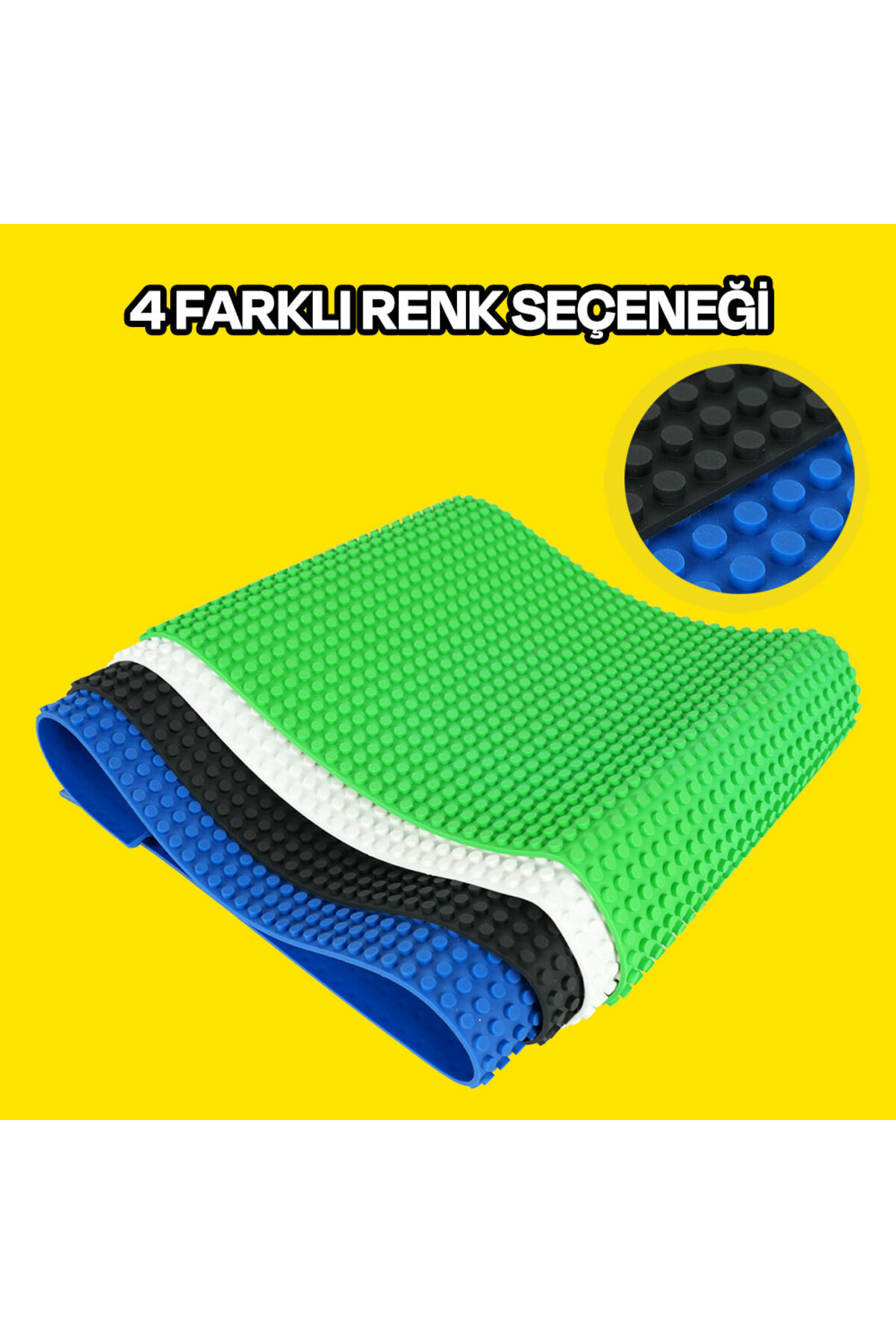 Sarı arka plan üzerinde yeşil, beyaz, siyah ve mavi renklerde dört renkli, esnek Lego taban plakası.