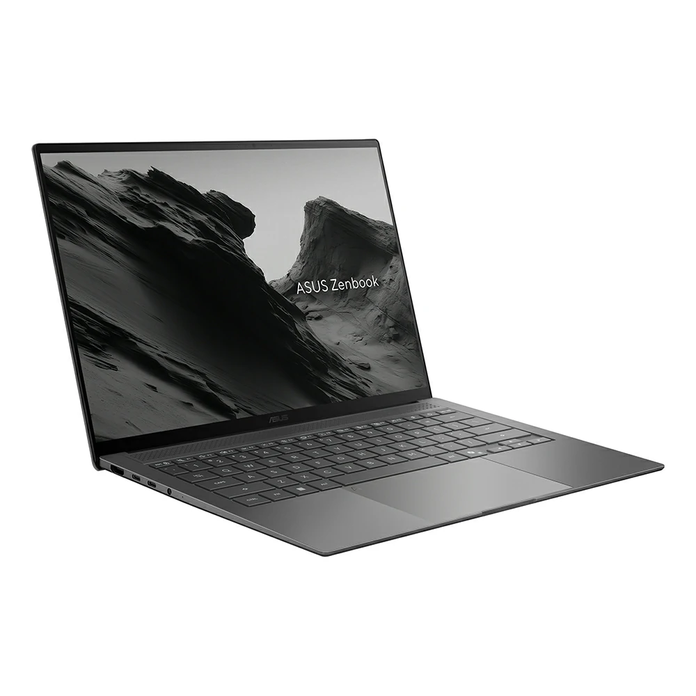 Un laptop Asus Zenbook grigio con tastiera nera e sfondo di montagna.