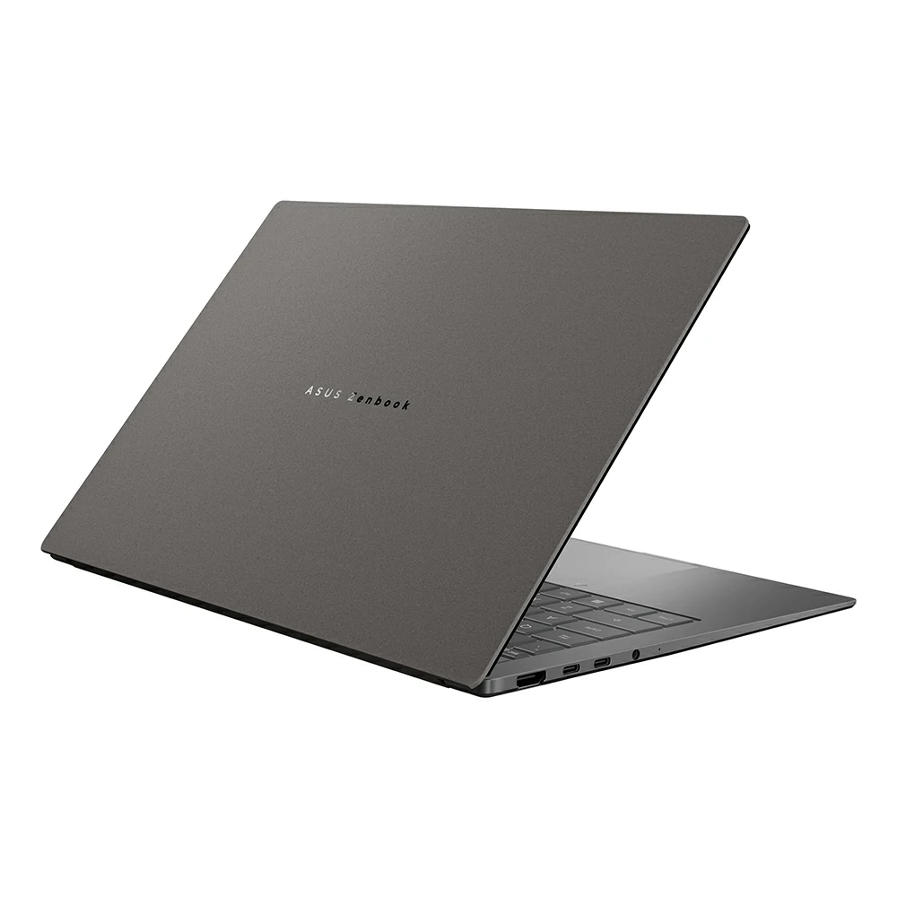 Un laptop ASUS Zenbook grigio visto di lato su sfondo bianco.