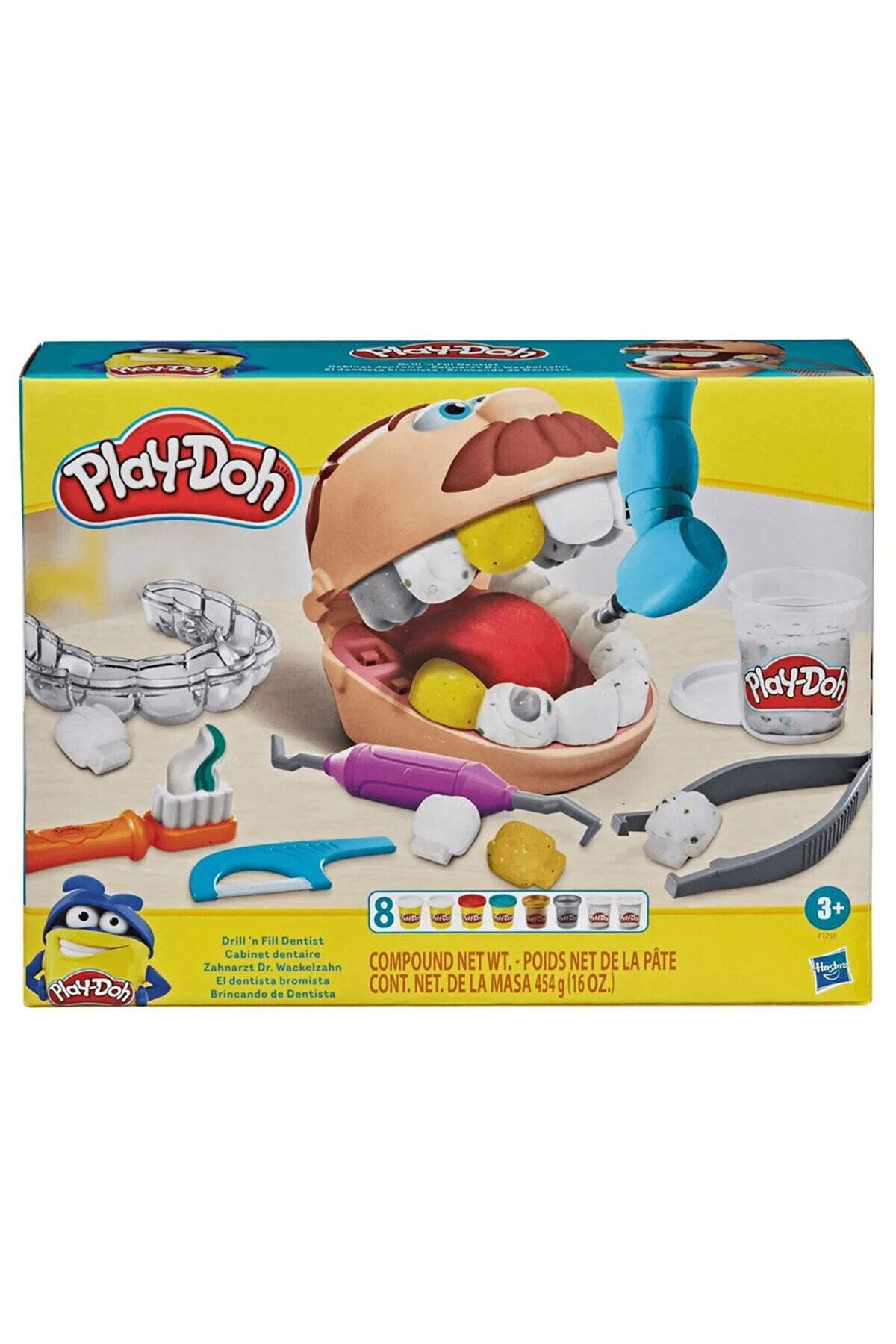 Renkli kutu içinde plastik dişler, aletler ve oyun hamuru içeren Play-Doh dişçi seti.
