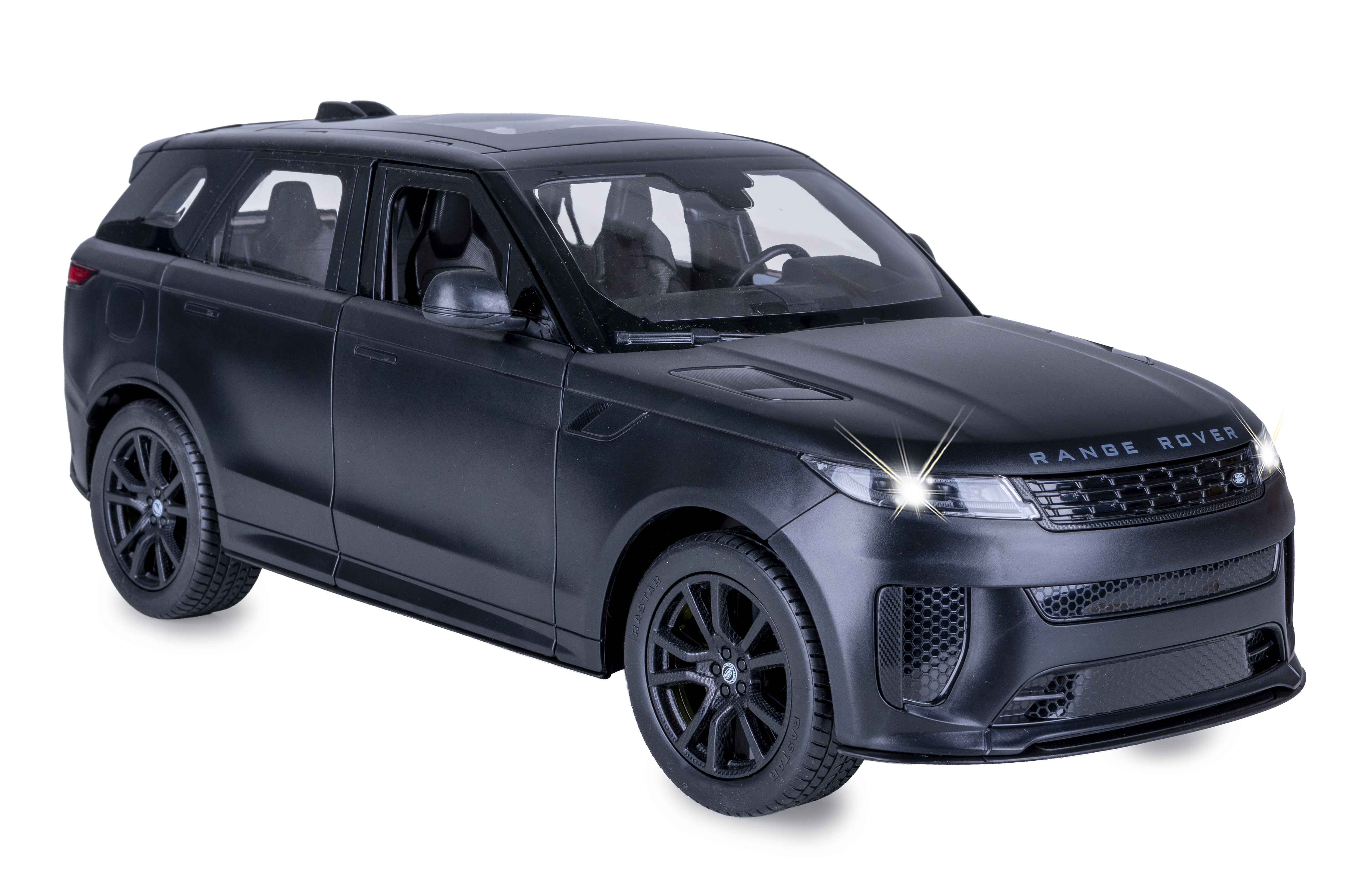 Ein mattSchwarzes Range-Rover-Modellauto vor weißem Hintergrund mit leuchtenden Frontscheinwerfern.