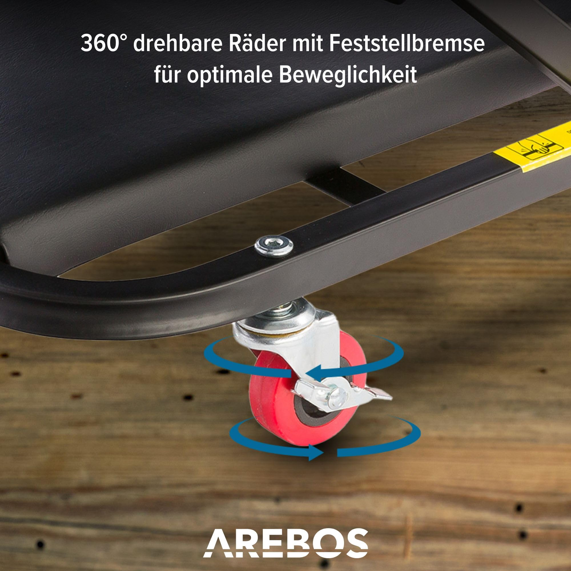 Rotes 360-Grad-Lenkrad mit Feststellbremse an einem schwarzen Rahmen.