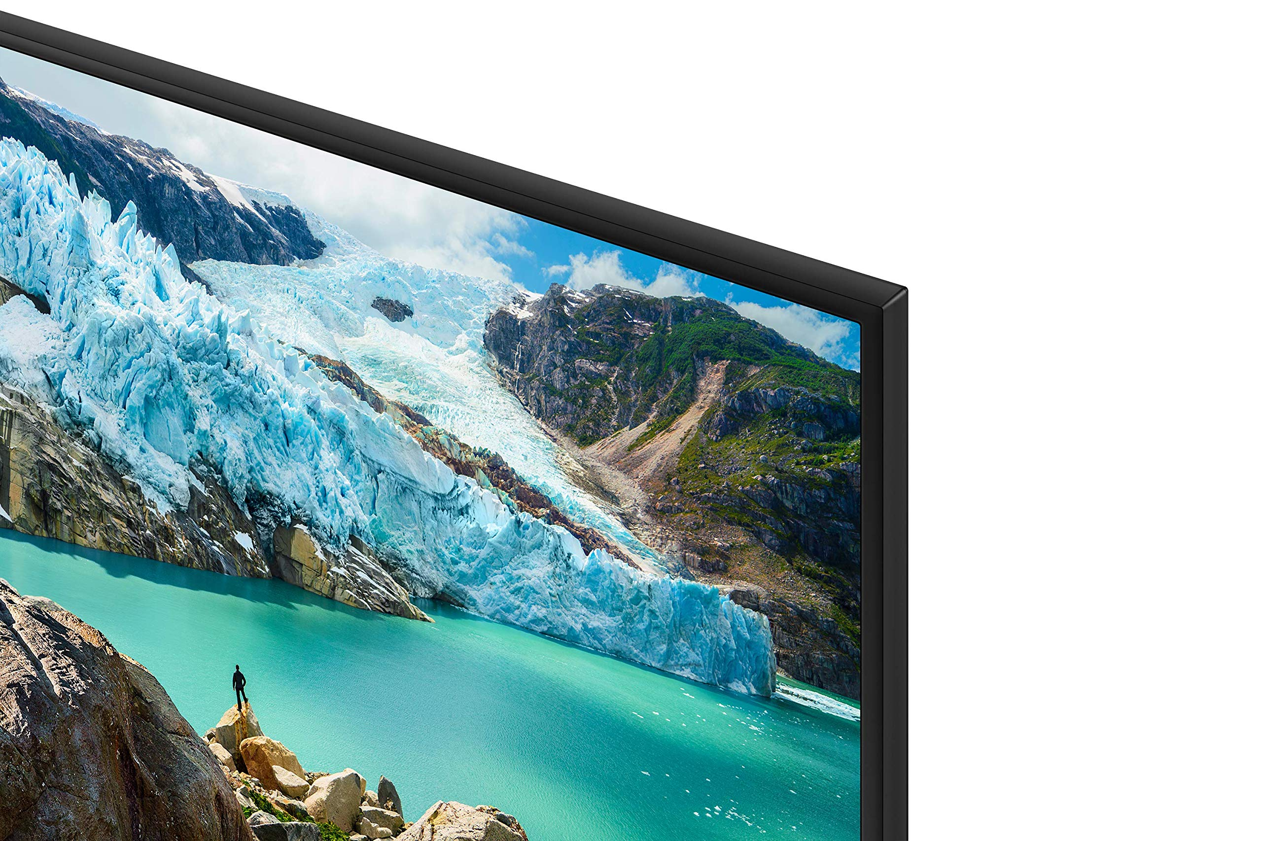 Une télévision affiche un paysage glaciaire avec de l'eau turquoise et des montagnes.