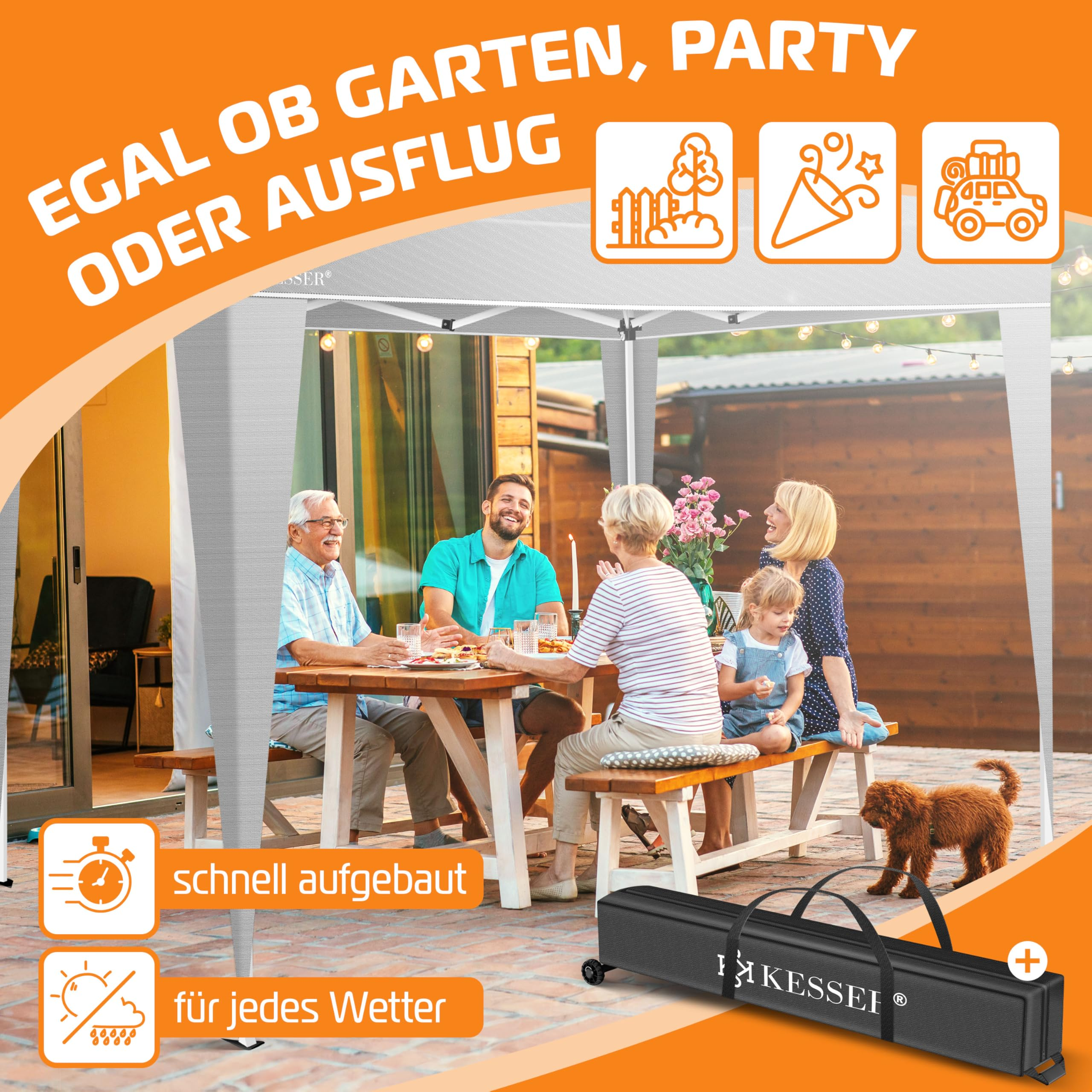 Familie sitzt unter weißem Pavillon im Garten am Tisch, mit Hund und Tragetasche.
