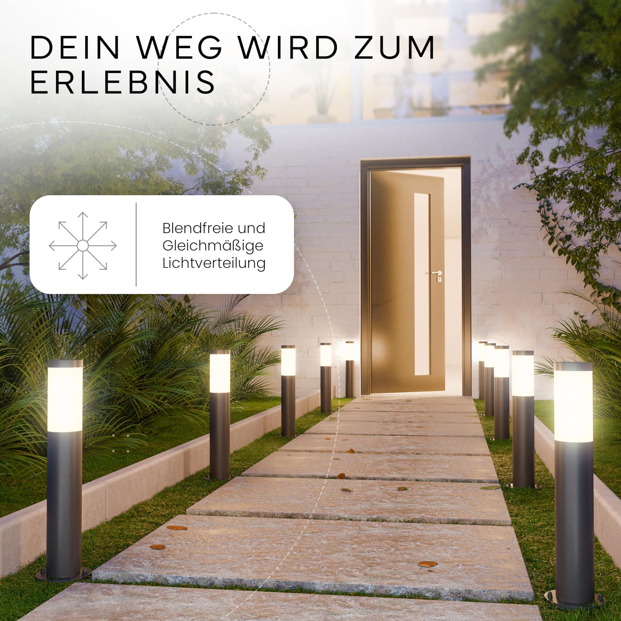 Un vialetto illuminato conduce all'ingresso, fiancheggiato da lampioncini e verde.