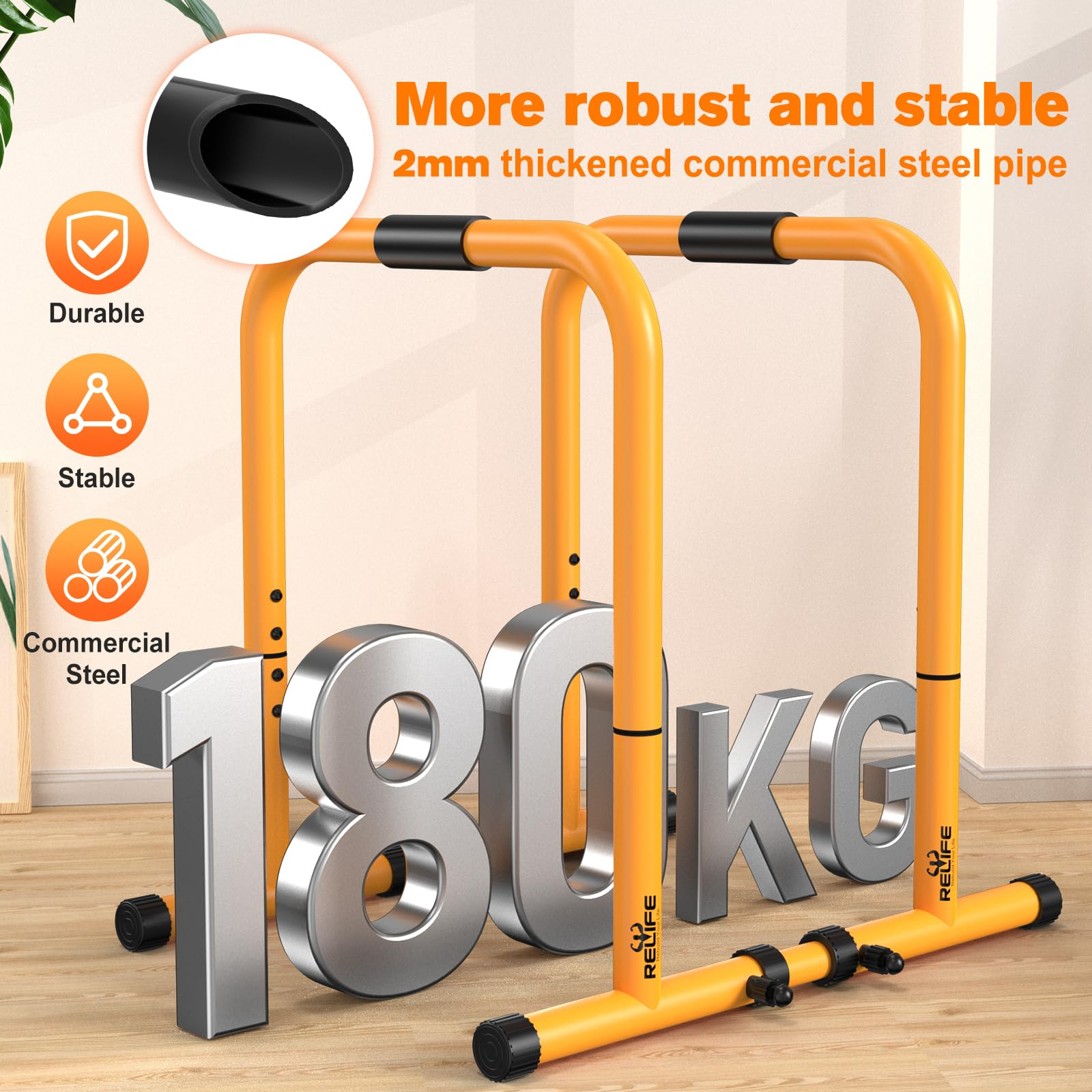 Zwei orange Dip-Stangen mit dicken Stahlrohren und großem 180kg Text vorne.