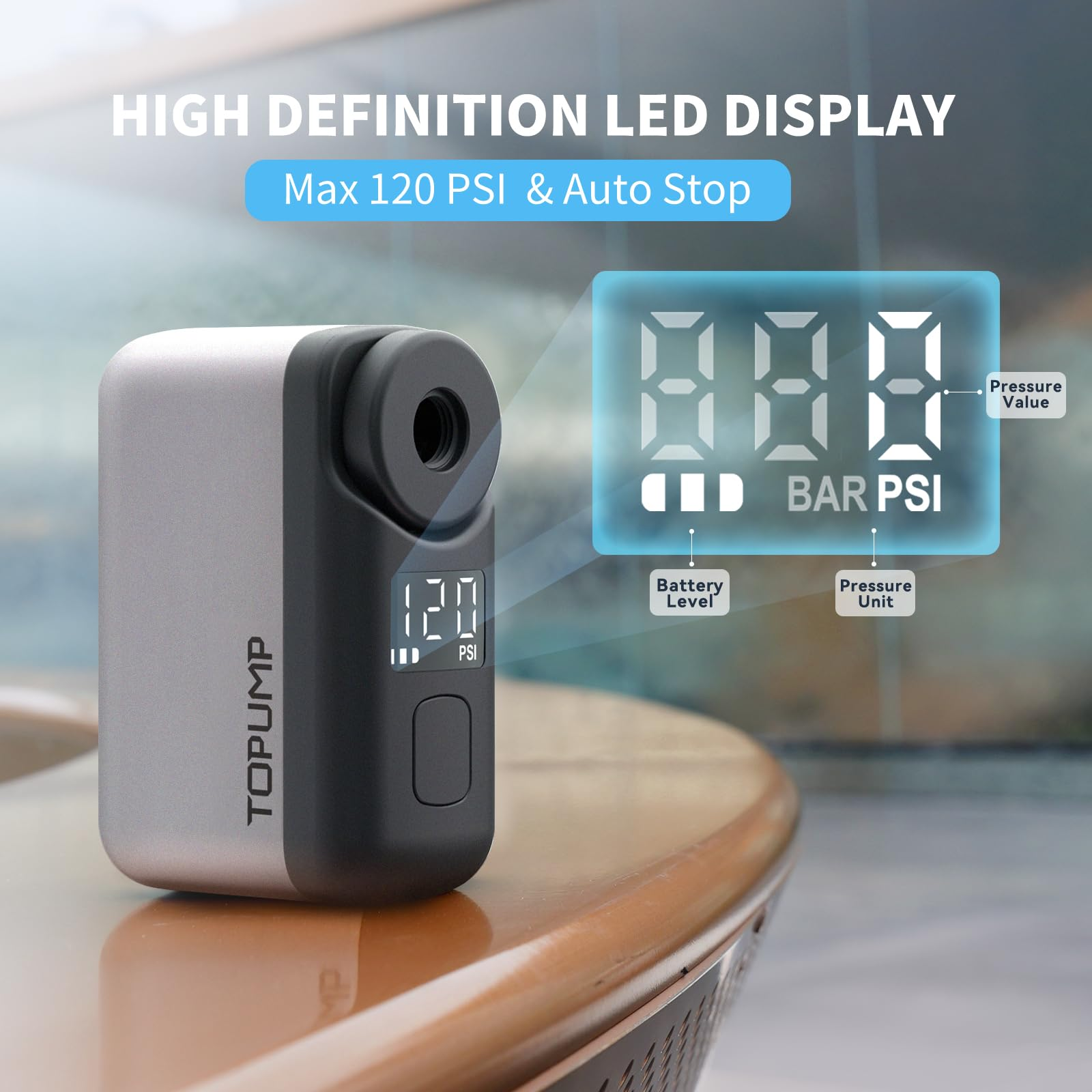 Kompakte silber-schwarze LED-Luftpumpe auf einem Tisch mit digitalem Display für Druck und Batteriestand.