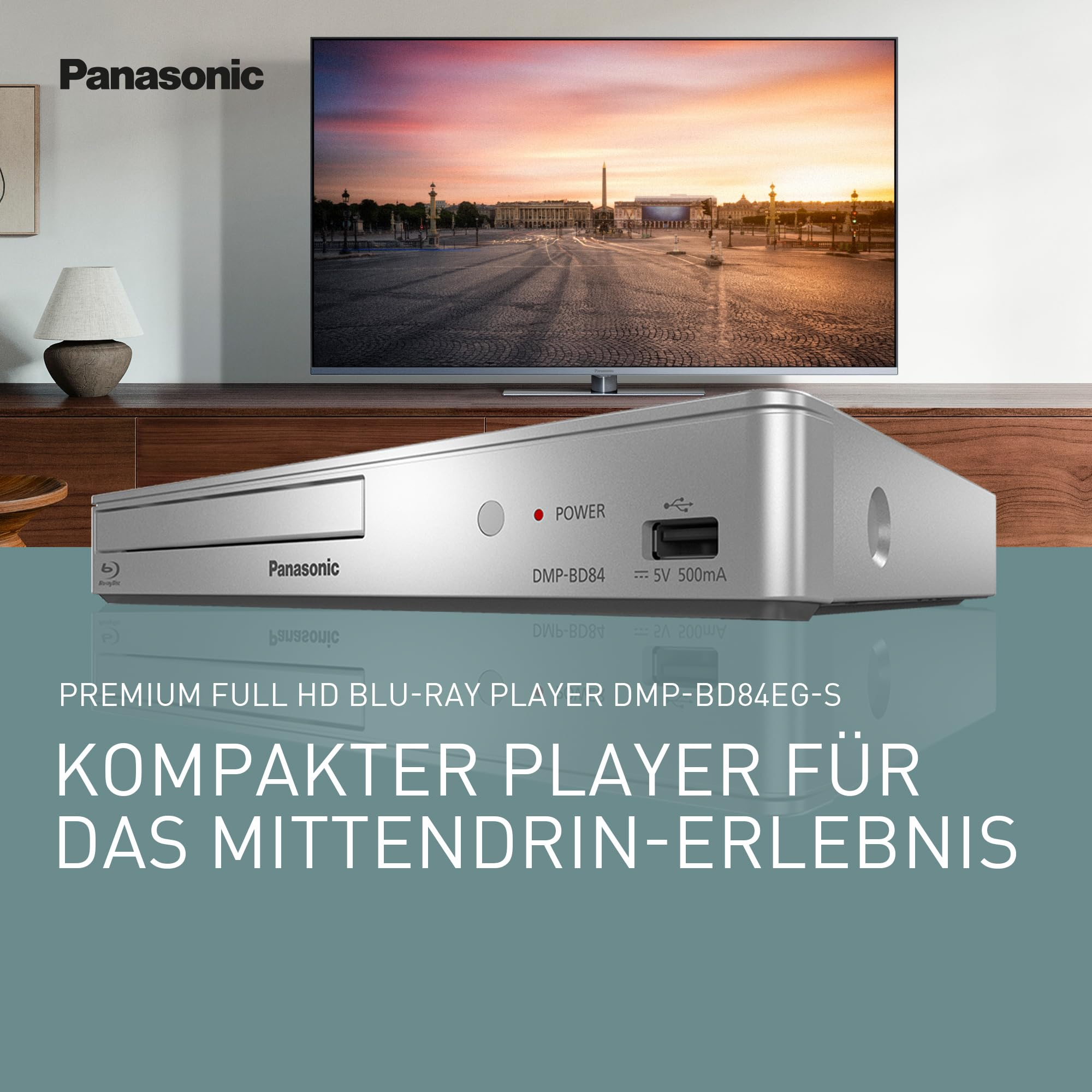 Lettore Blu-Ray Panasonic argento davanti a TV e parete con testo promozionale.
