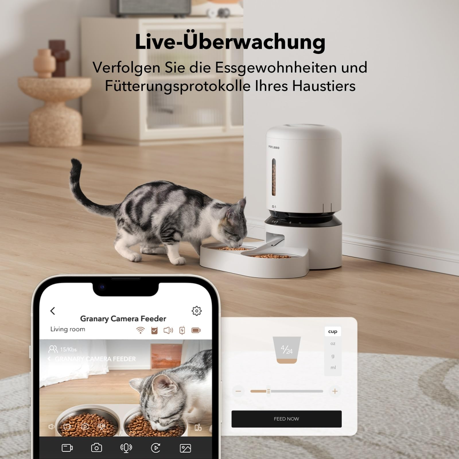 Un chat mange dans un distributeur intelligent, avec une application mobile montrant le suivi en direct au premier plan.
