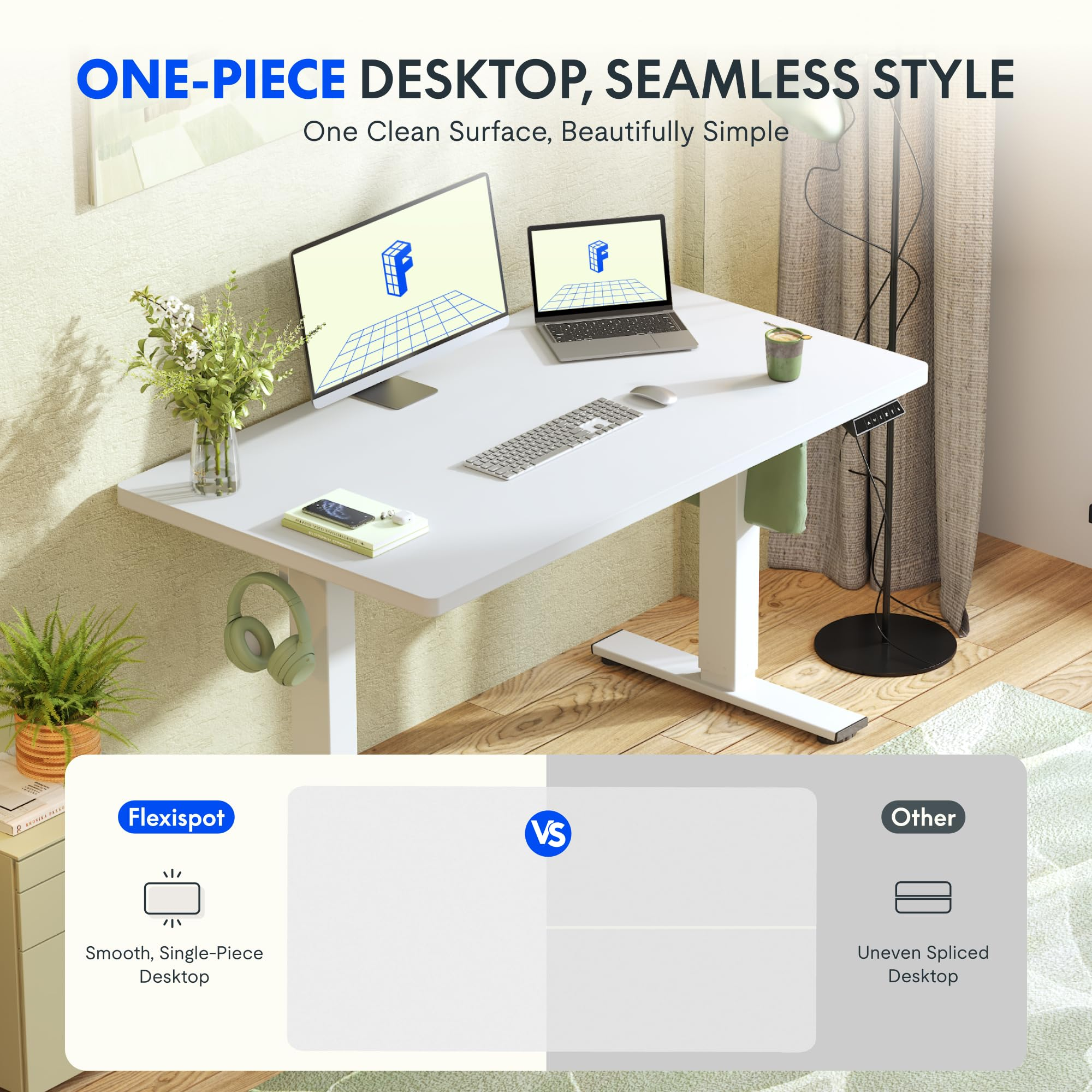 Un bureau blanc réglable en hauteur avec un moniteur, un ordinateur portable et des fleurs.