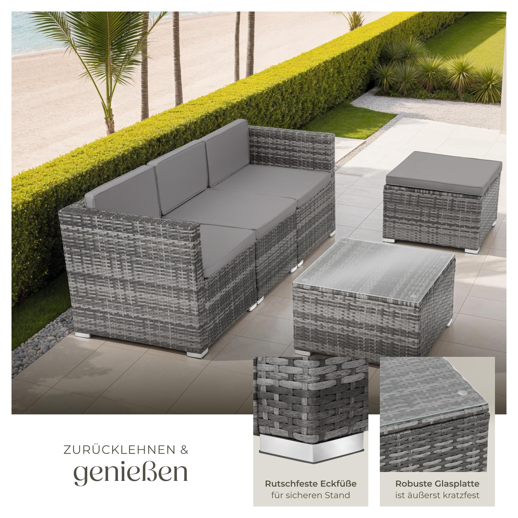 Graues Polyrattan-Lounge-Set mit Sofa, Hocker und Glastisch auf einer Terrasse.