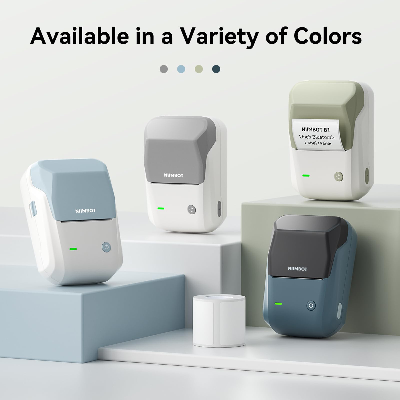 Quatre étiqueteuses Niimbot B1 de différentes couleurs pastel présentées sur des socles.