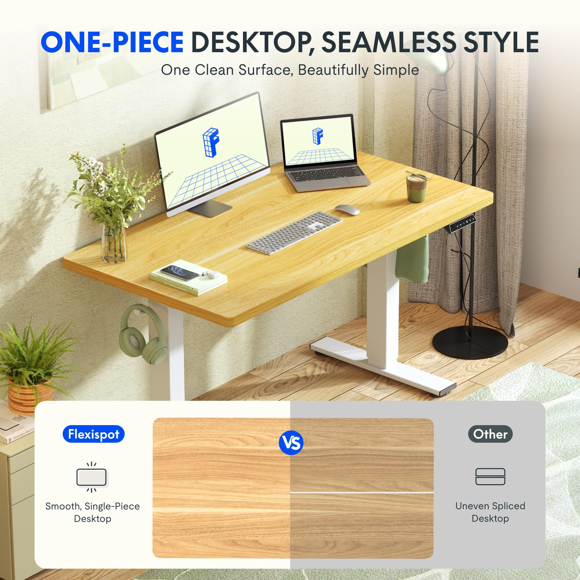 Un bureau debout en bois avec moniteur, ordinateur portable, clavier et fleurs dans une pièce.