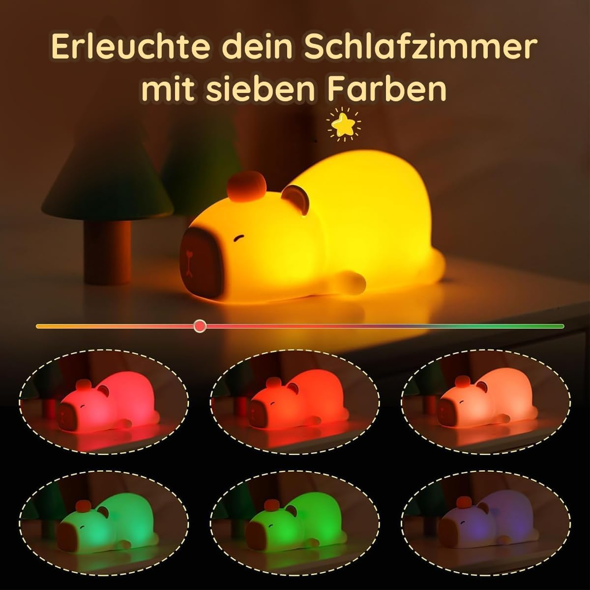 Ein gelbes Capybara-Nachtlicht auf einem Tisch mit kleinen grünen Bäumen im Hintergrund.