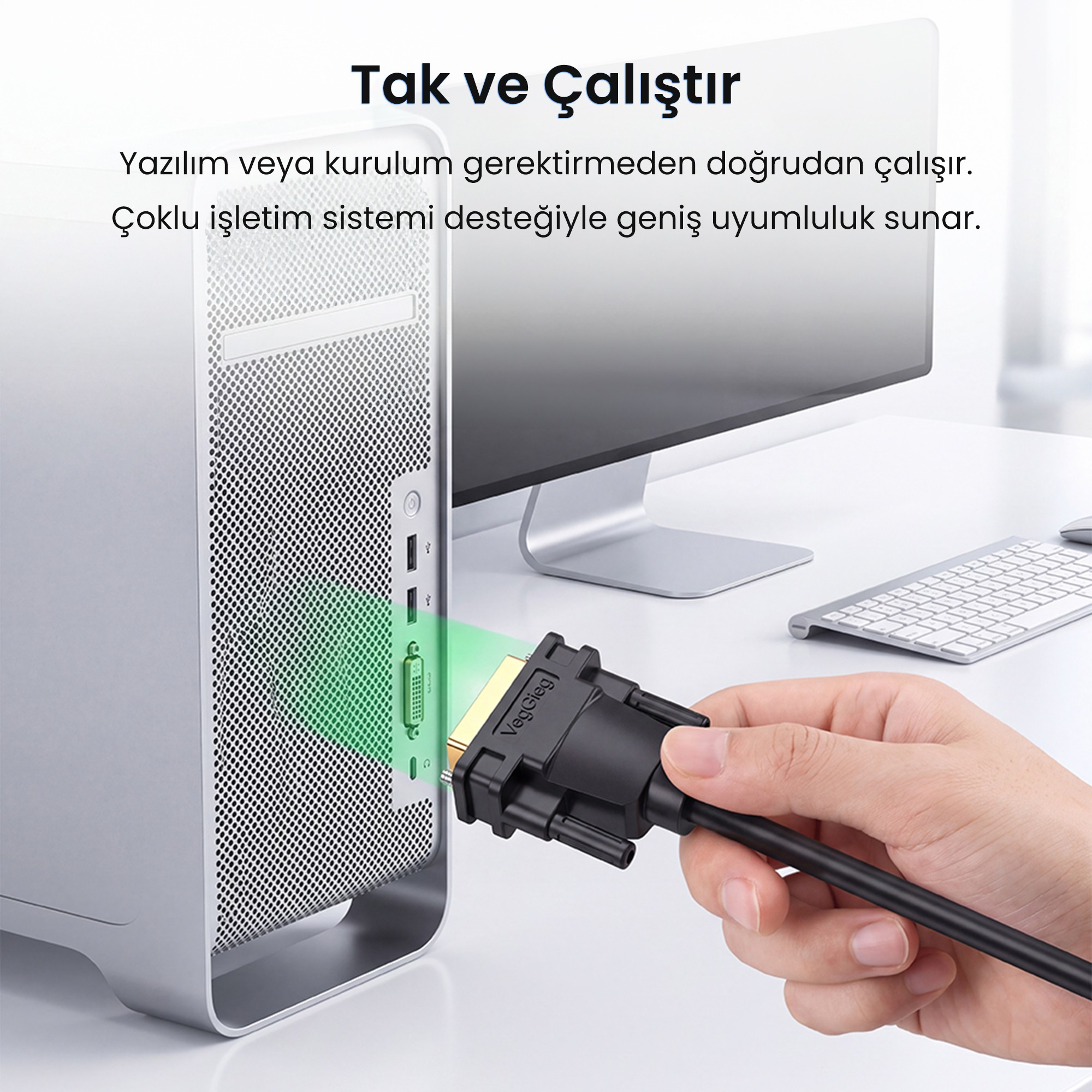Arka planda monitör ve Türkçe yazıyla bir bilgisayar portuna DVI kablosu bağlayan bir el.