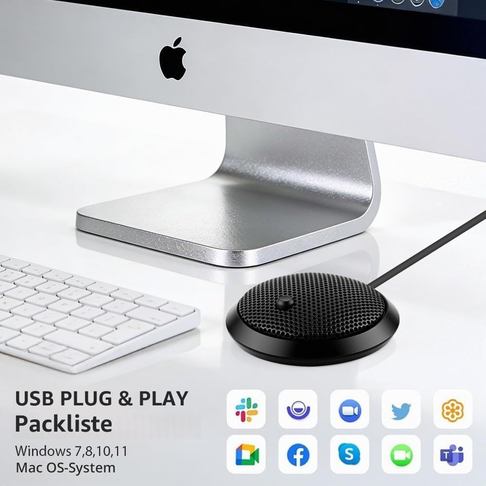 Schwarzes USB-Mikrofon auf weißem Schreibtisch mit Mac, Tastatur und App-Icons.