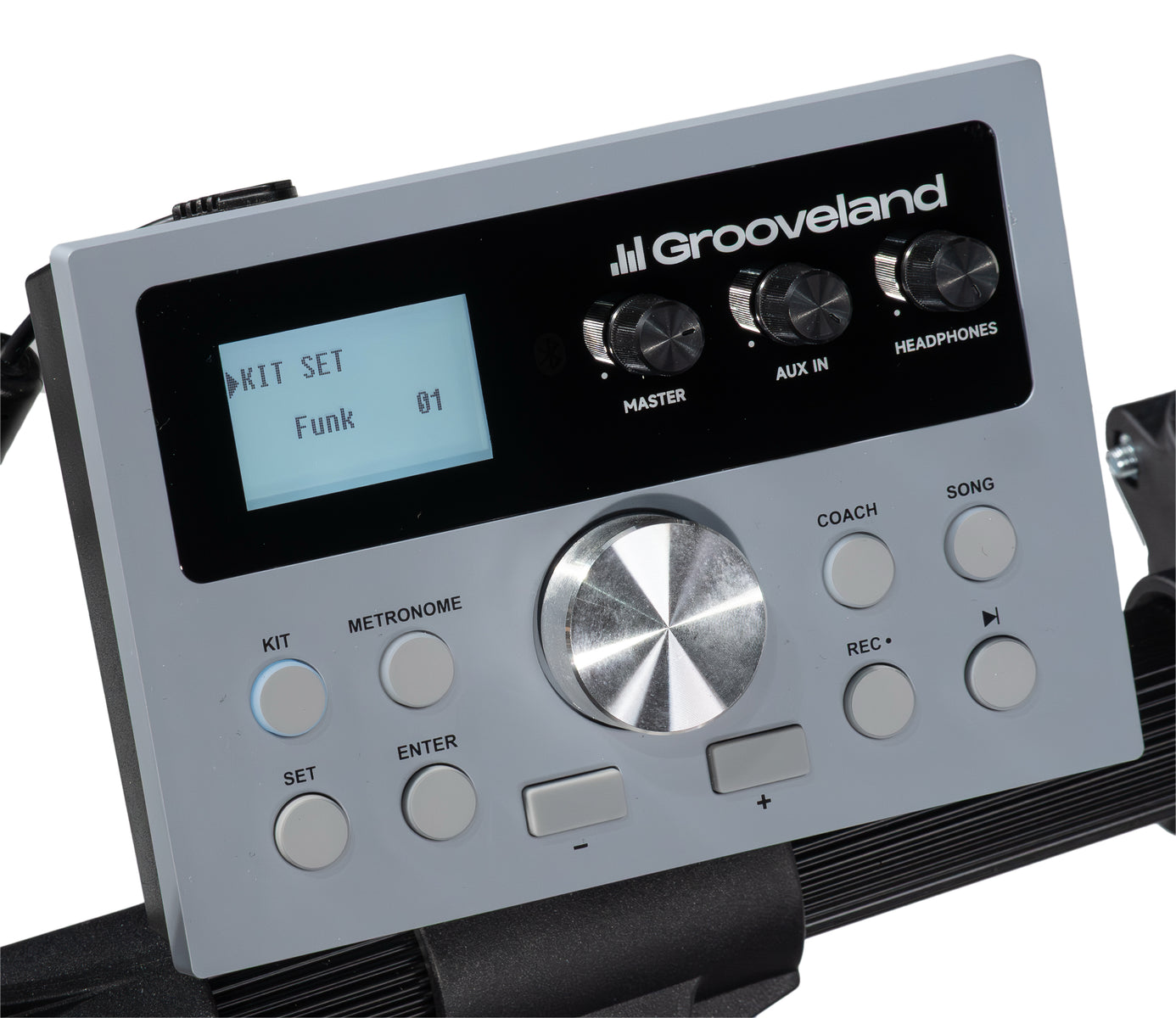 Graues Grooveland E-Drum-Modul mit beleuchtetem Bildschirm, Reglern und grauen Tasten auf schwarzem Halter.