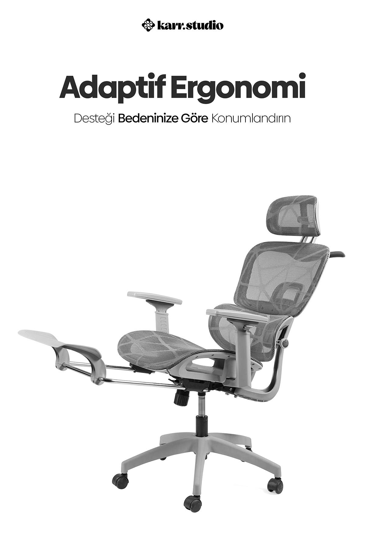 Beyaz arka planda ayak uzatmalı gri fileli ergonomik ofis koltuğu.