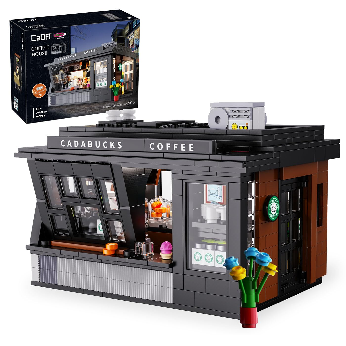 Ein schwarz-braunes Kaffeehaus-Modell aus Bausteinen mit der Produktbox darüber, beschriftet als Cadabucks Coffee.