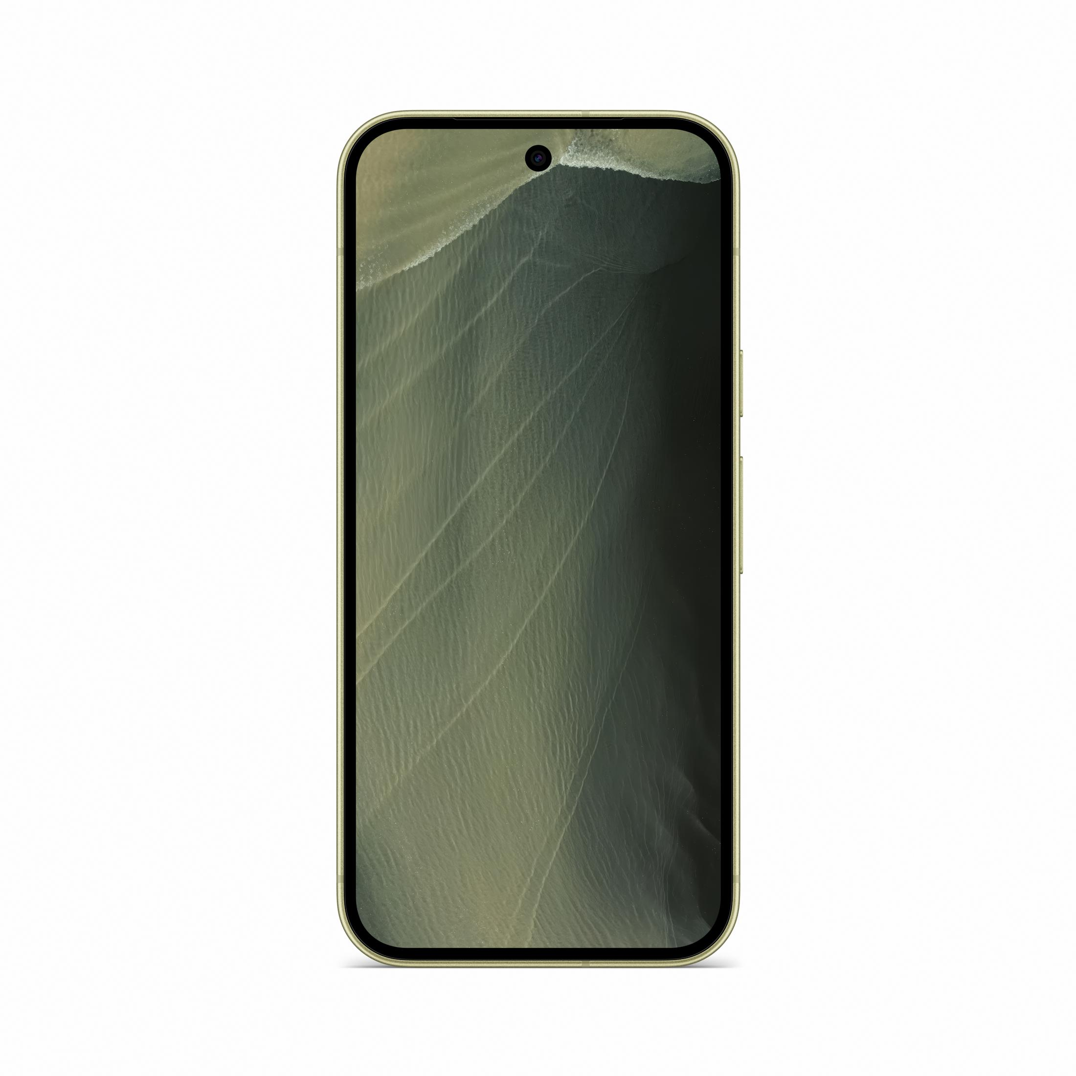 Złoty smartfon wyświetla na ekranie widok z góry na ciemną, falistą piaszczystą plażę.