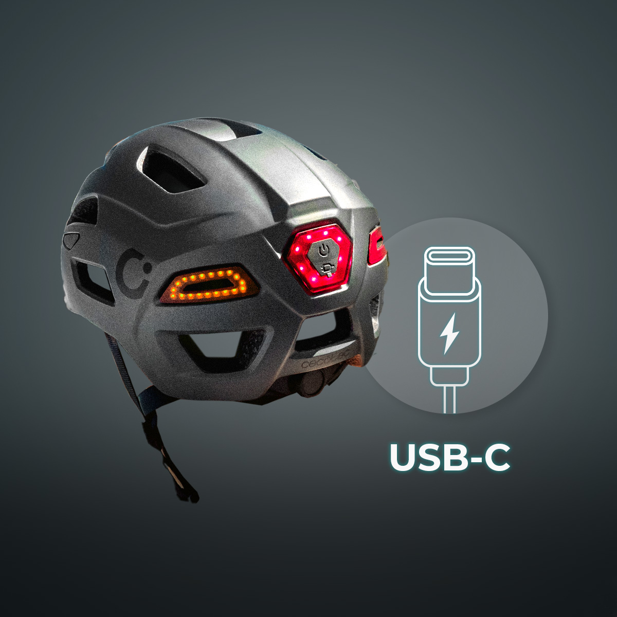 Casco de bicicleta gris con luces LED rojas y naranjas integradas y un icono de USB-C.