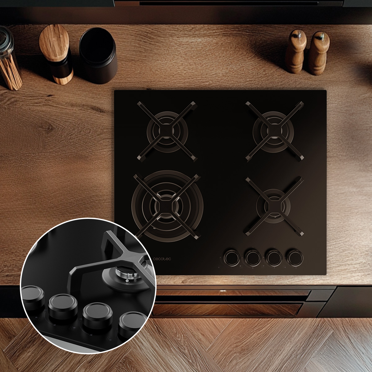 Una encimera de gas negra de cuatro quemadores sobre una encimera de madera, con un detalle ampliado de los mandos.