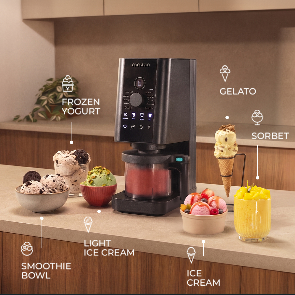 Gelatiera nera su un piano cucina circondata da vari dessert come gelato, sorbetto e smoothie bowl.
