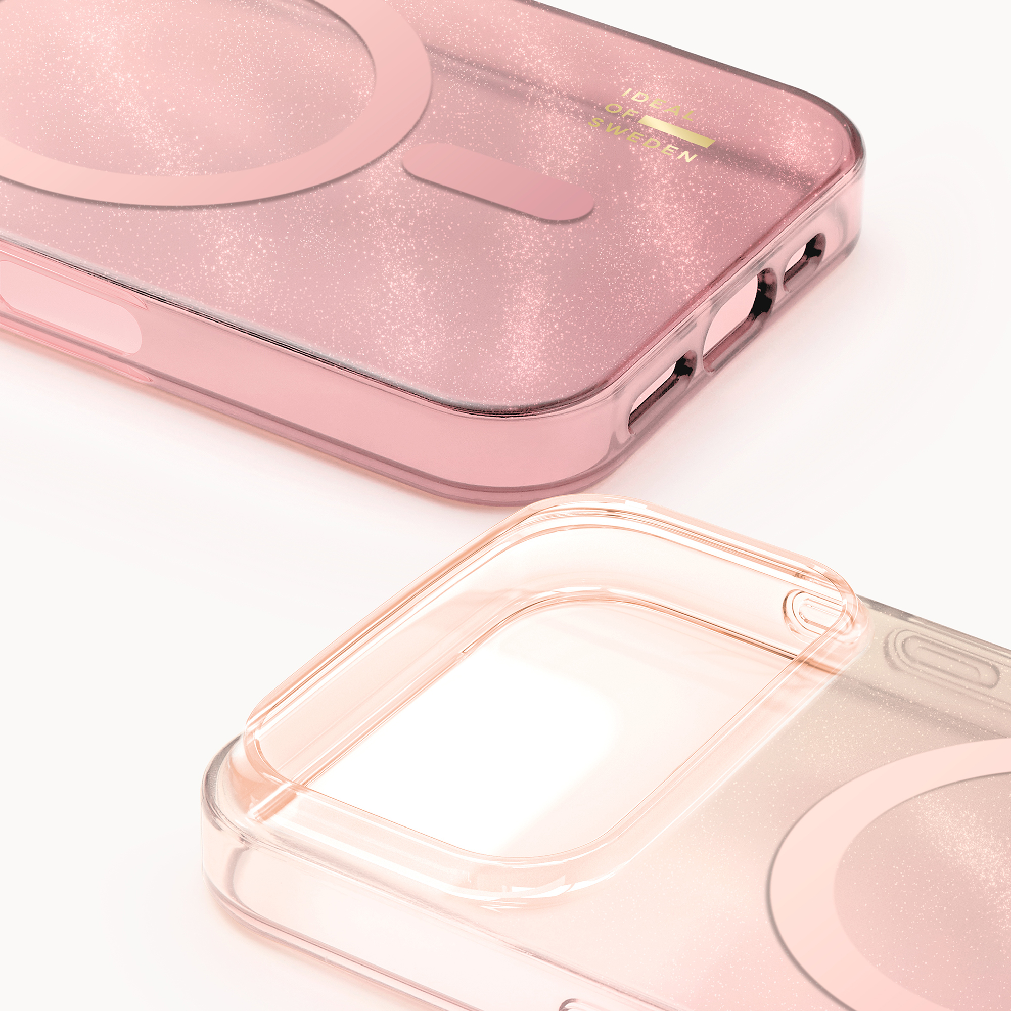 Due custodie per smartphone rosa glitterate su sfondo bianco.