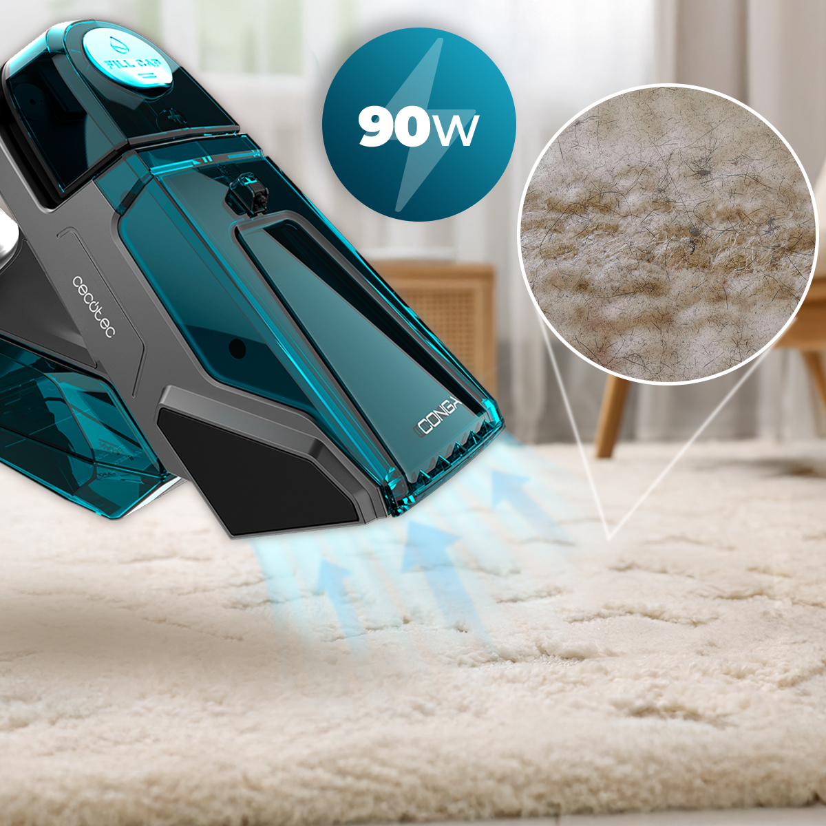 Un aspirapolvere portatile blu e nero da 90W pulisce un tappeto, con un cerchio che mostra le fibre sporche.