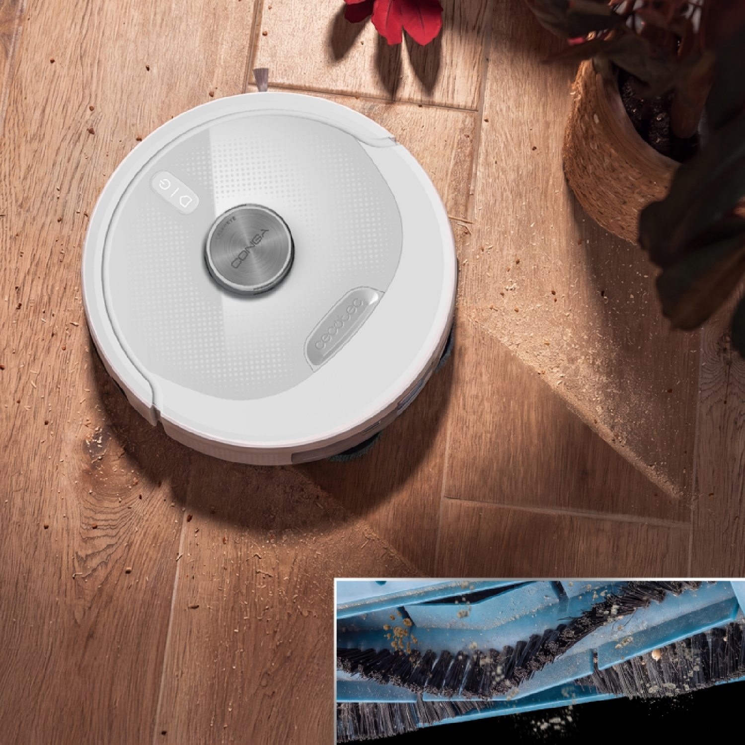 Un robot aspirador blanco limpia un suelo de madera con virutas. Abajo, un detalle de los cepillos azules.