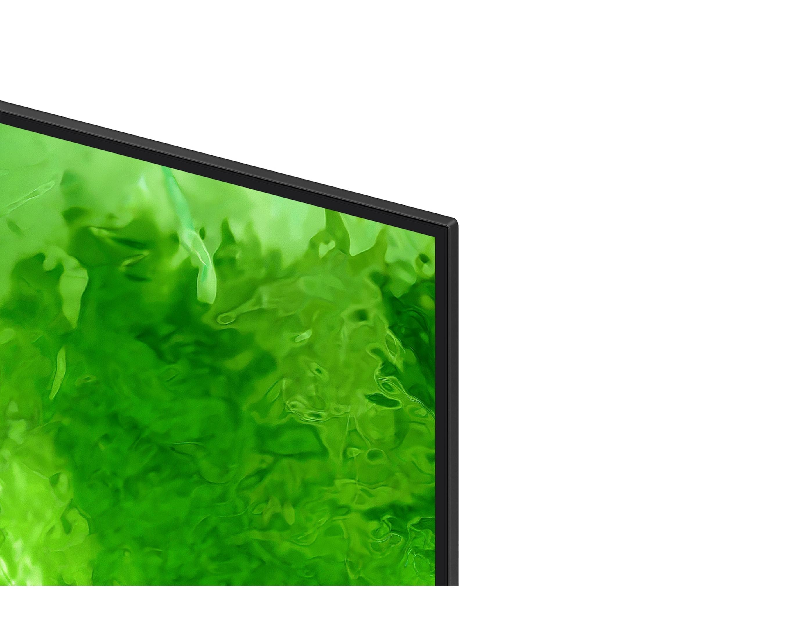 Primo piano di un moderno schermo TV con un vivace motivo liquido verde su sfondo bianco.