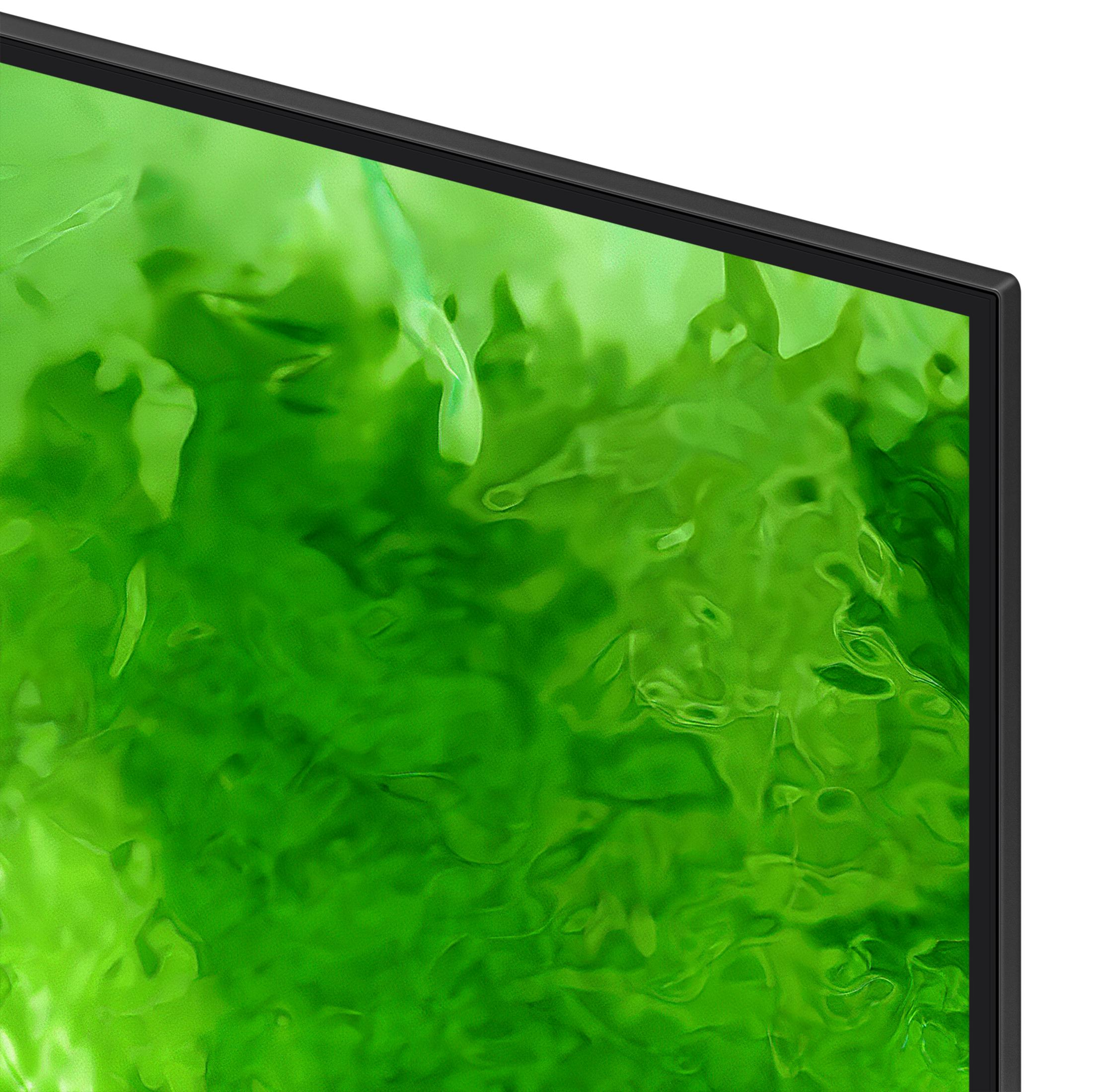 Primo piano dell'angolo di una TV con uno sfondo liquido verde.