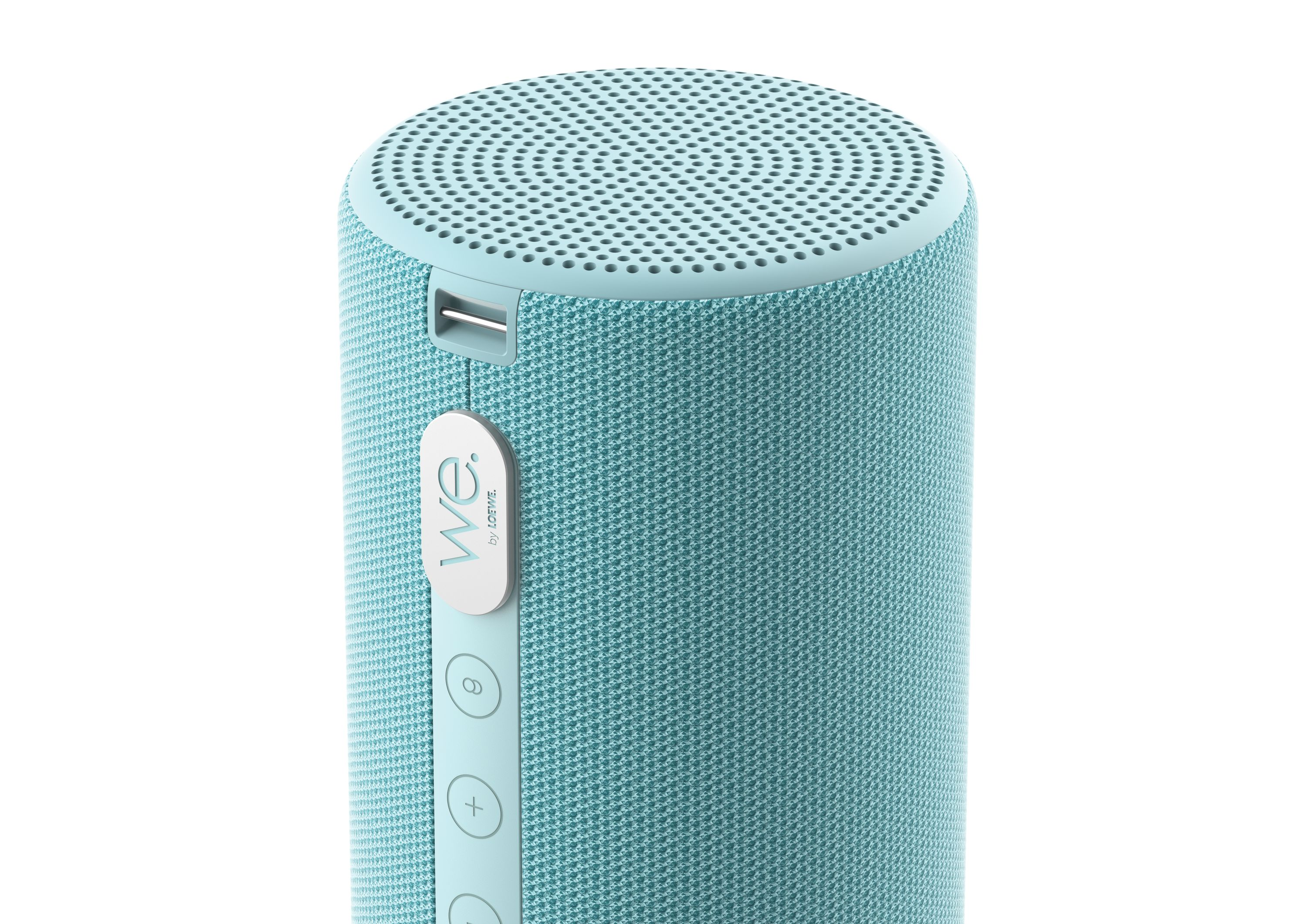 Ein zyphenförmiger türkiser Bluetooth-Lautsprecher mit weißer Markenaufschrift.