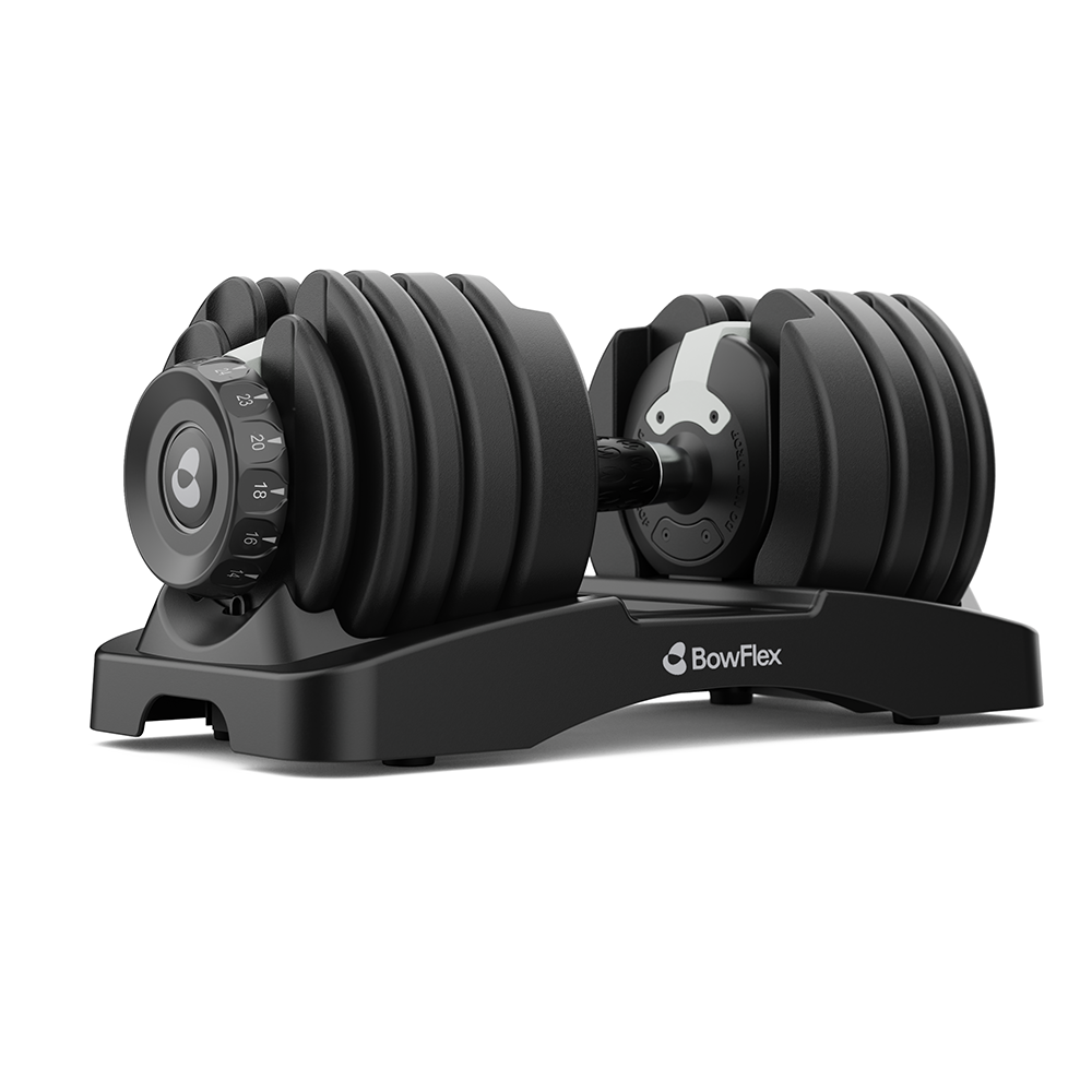 Mancuerna ajustable negra Bowflex en su soporte a juego contra un fondo blanco.