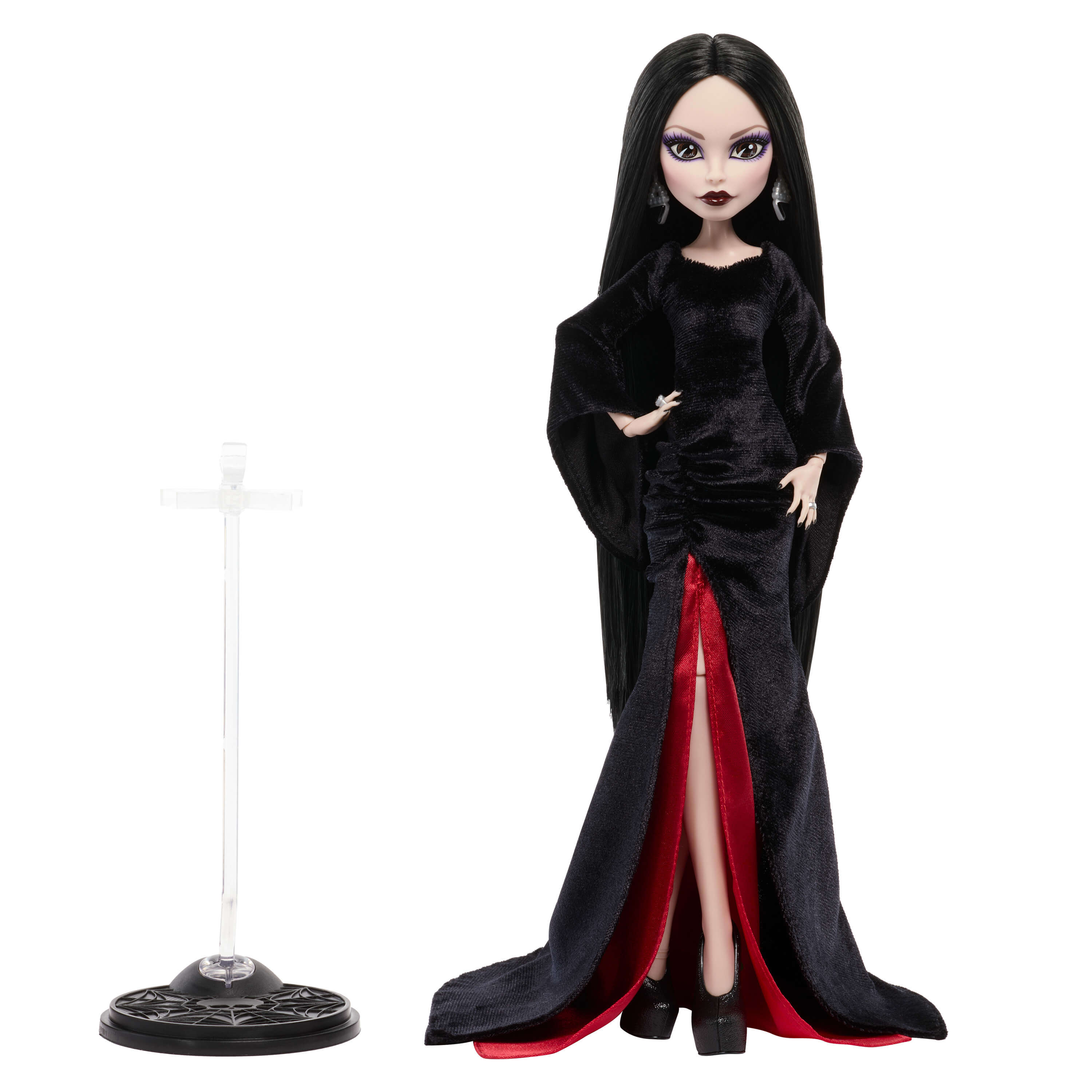 Una muñeca de estilo gótico con largo pelo negro, vestido negro con forro rojo y un soporte separado.