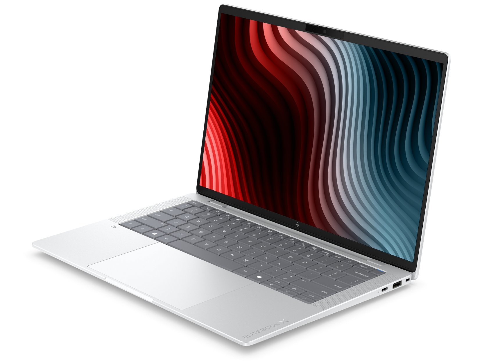 Laptop argentato aperto su superficie bianca con uno sfondo astratto a onde colorate.